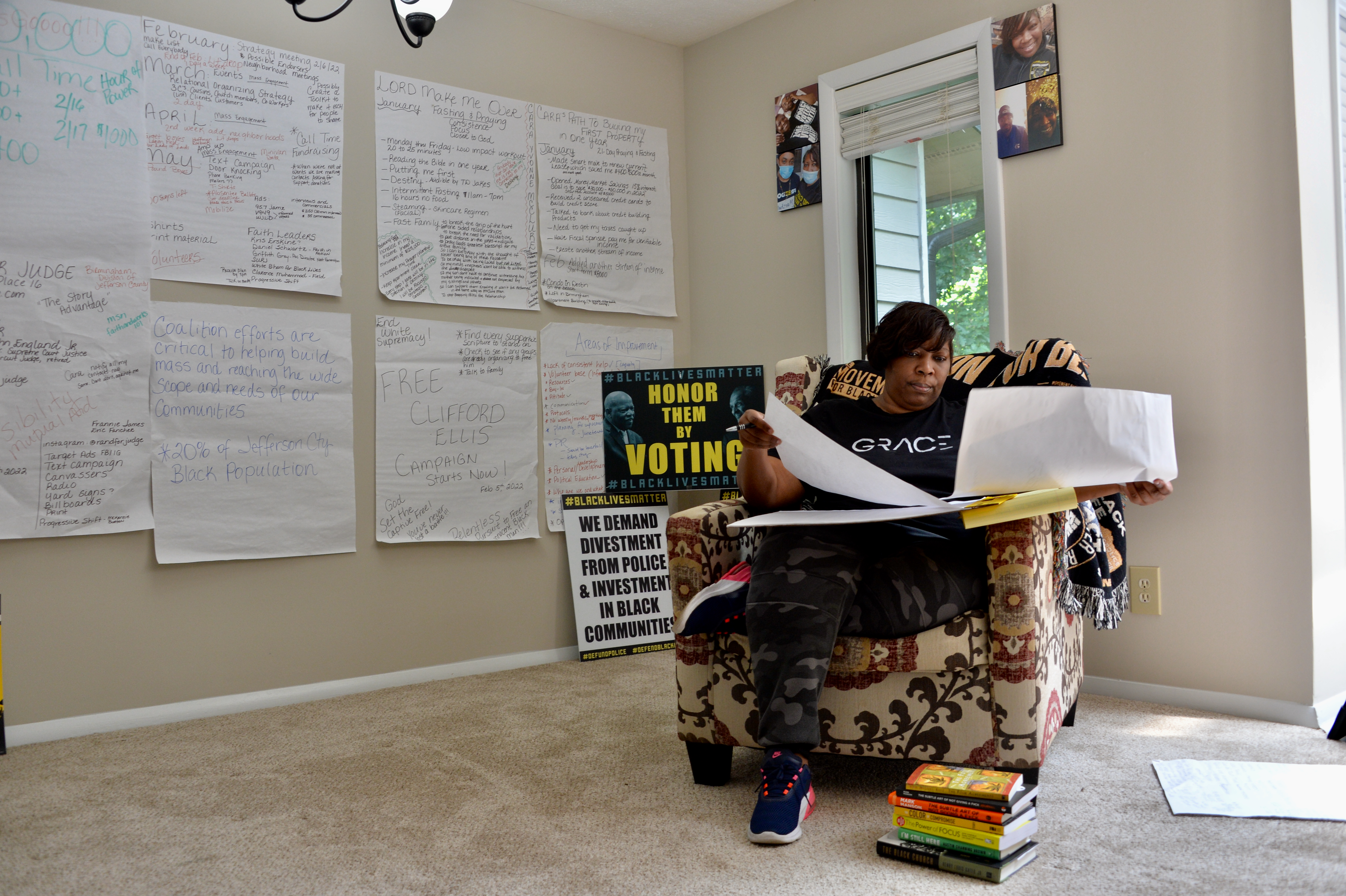 Cara McClure works in her apartment that doubles as an office