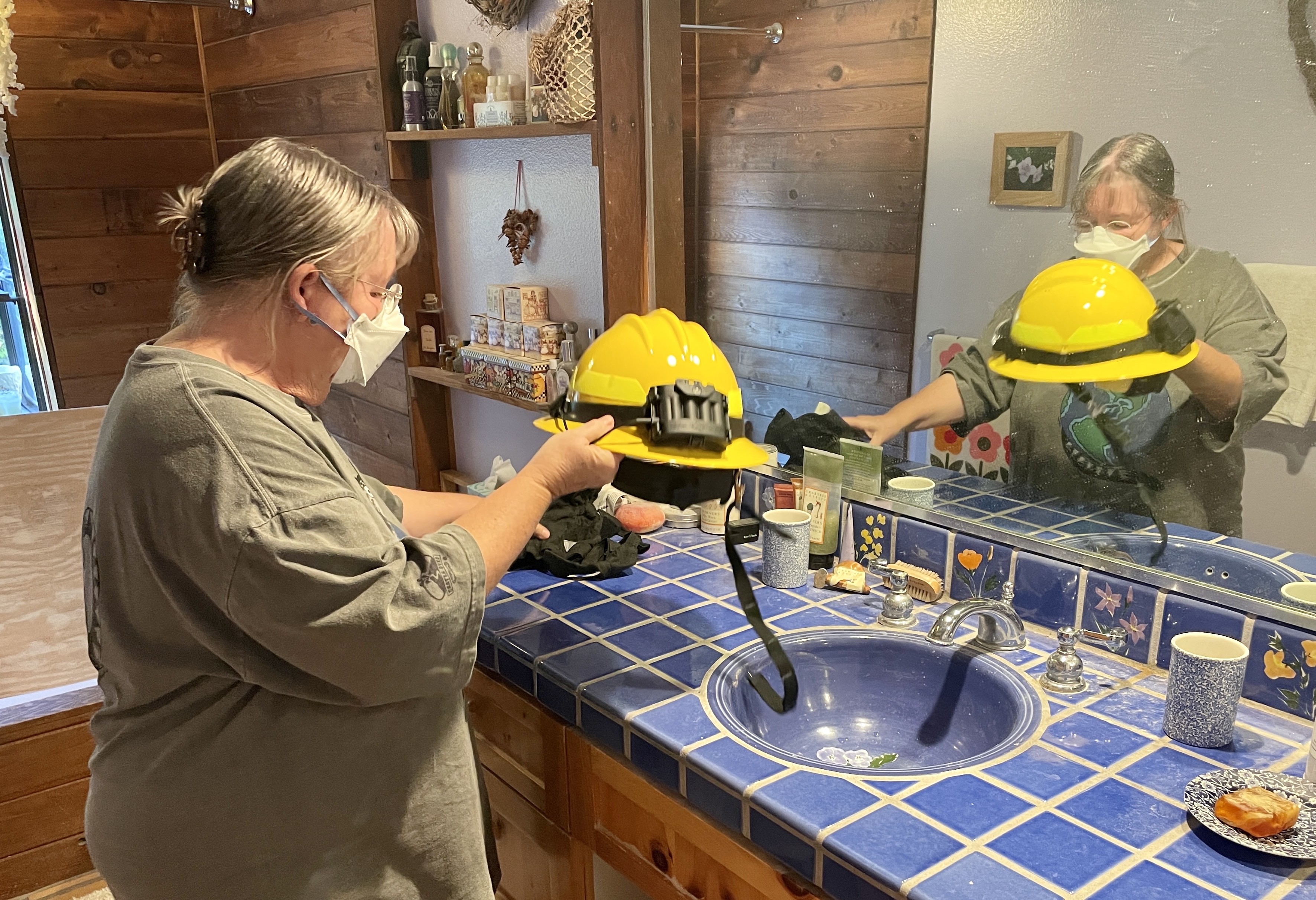 Jane Terjung shows off her fire protection gear