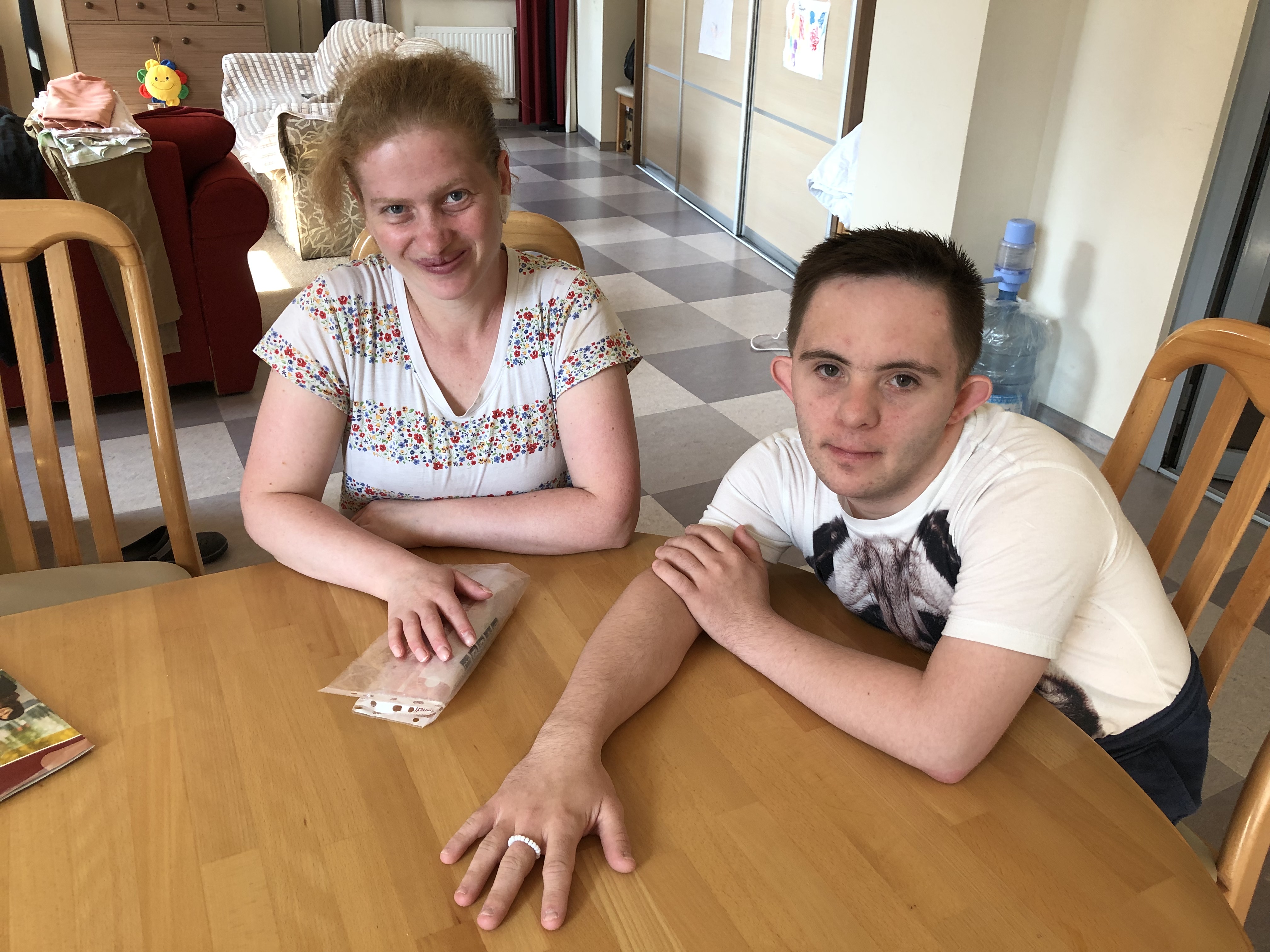 A photo of Ivanka (left) and Danylo (right) sitting on a table.