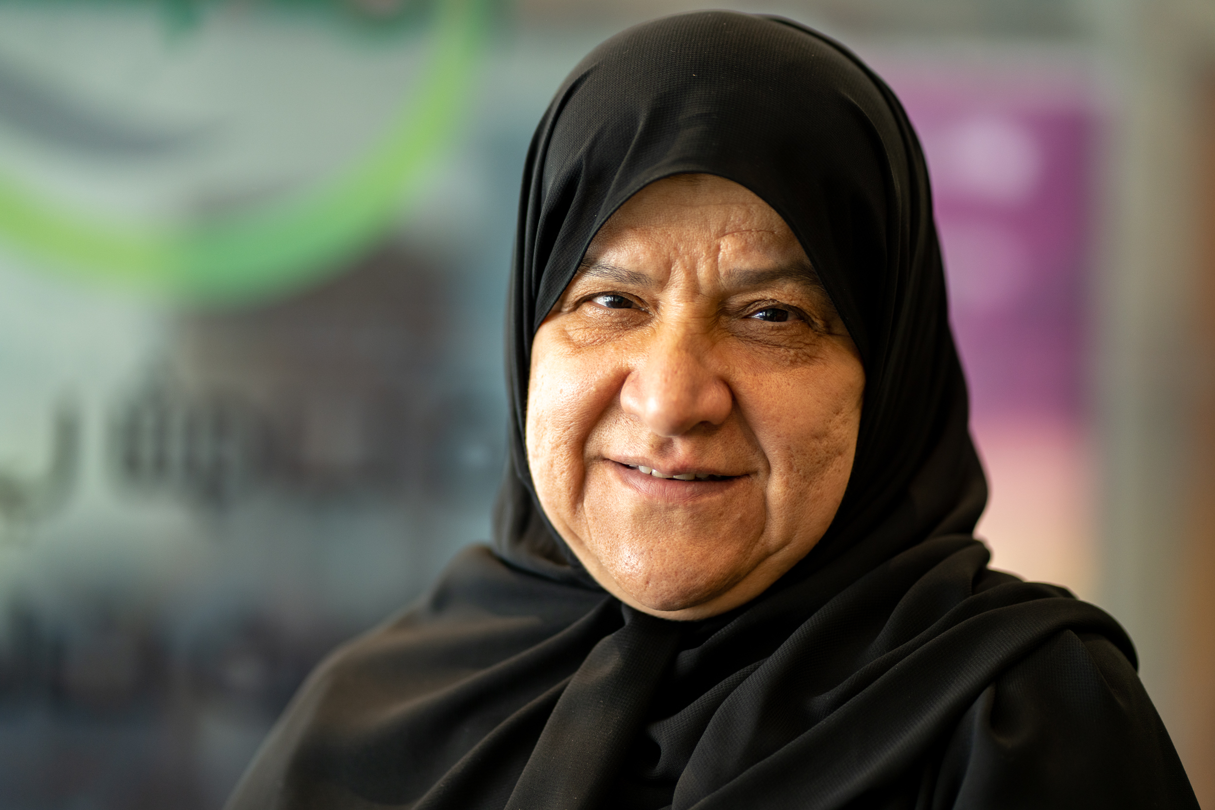 A phot of Shams as she smiles slightly at the camera