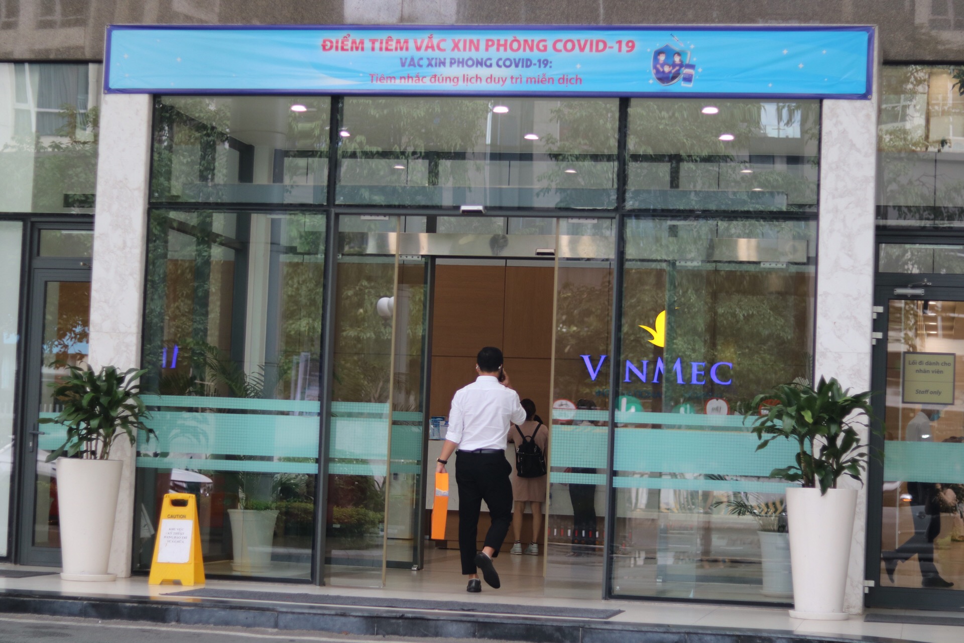 A man walks into Vinmec hospital in Ho Cho Minh City, Vietnam.