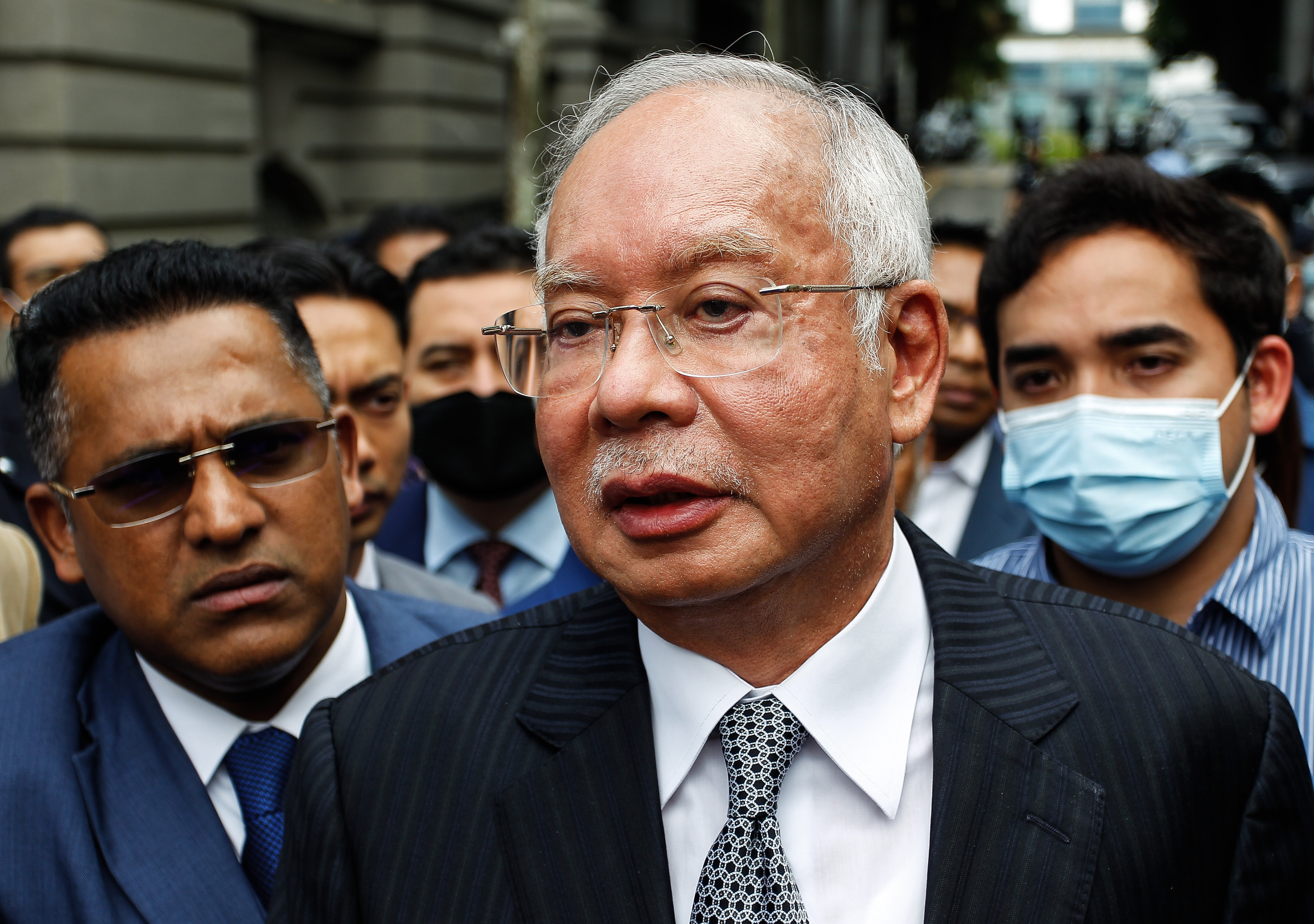 Malaysia's former prime minister Najib Razak (C) speaks to his supporters during a break in his final appeal trial outside the Federal Court in Putrajaya, Malaysia.