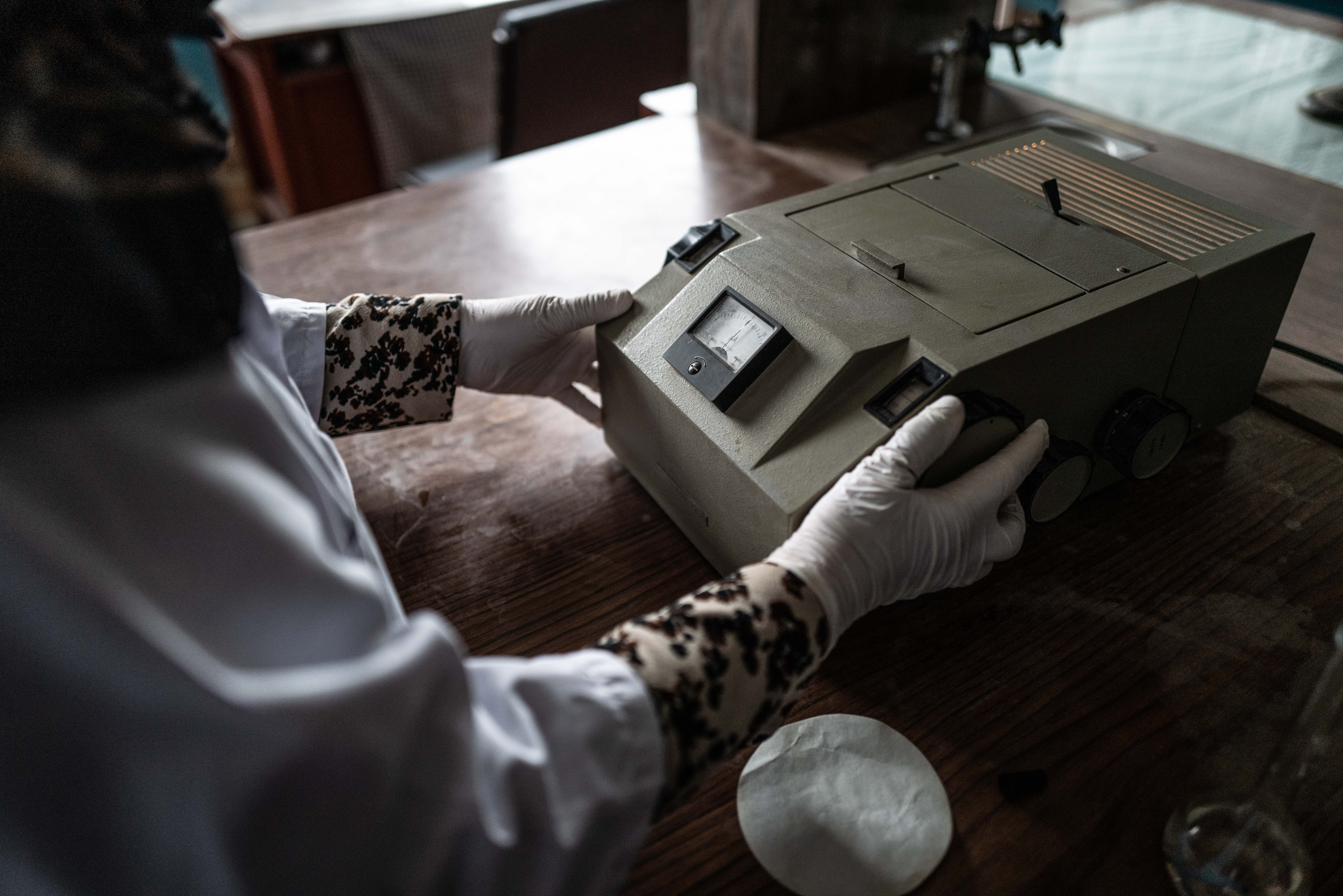 A photo of someone holding lab equipment.