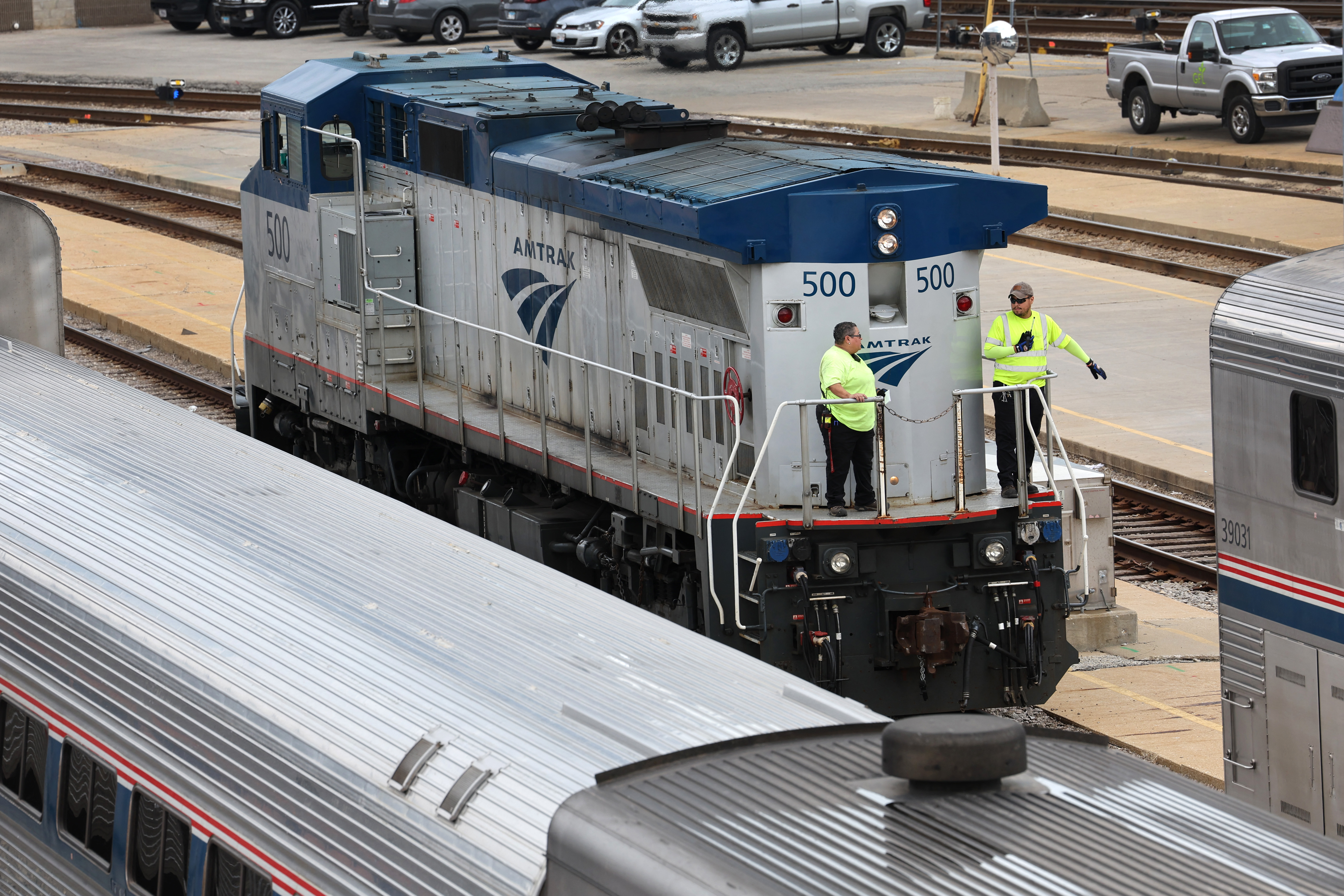 CHICAGO, ILLINOIS - SEPTEMBER 13: Workers service trains in the Amtrak Car Yard south of the Loop on September 13, 2022 in Chicago