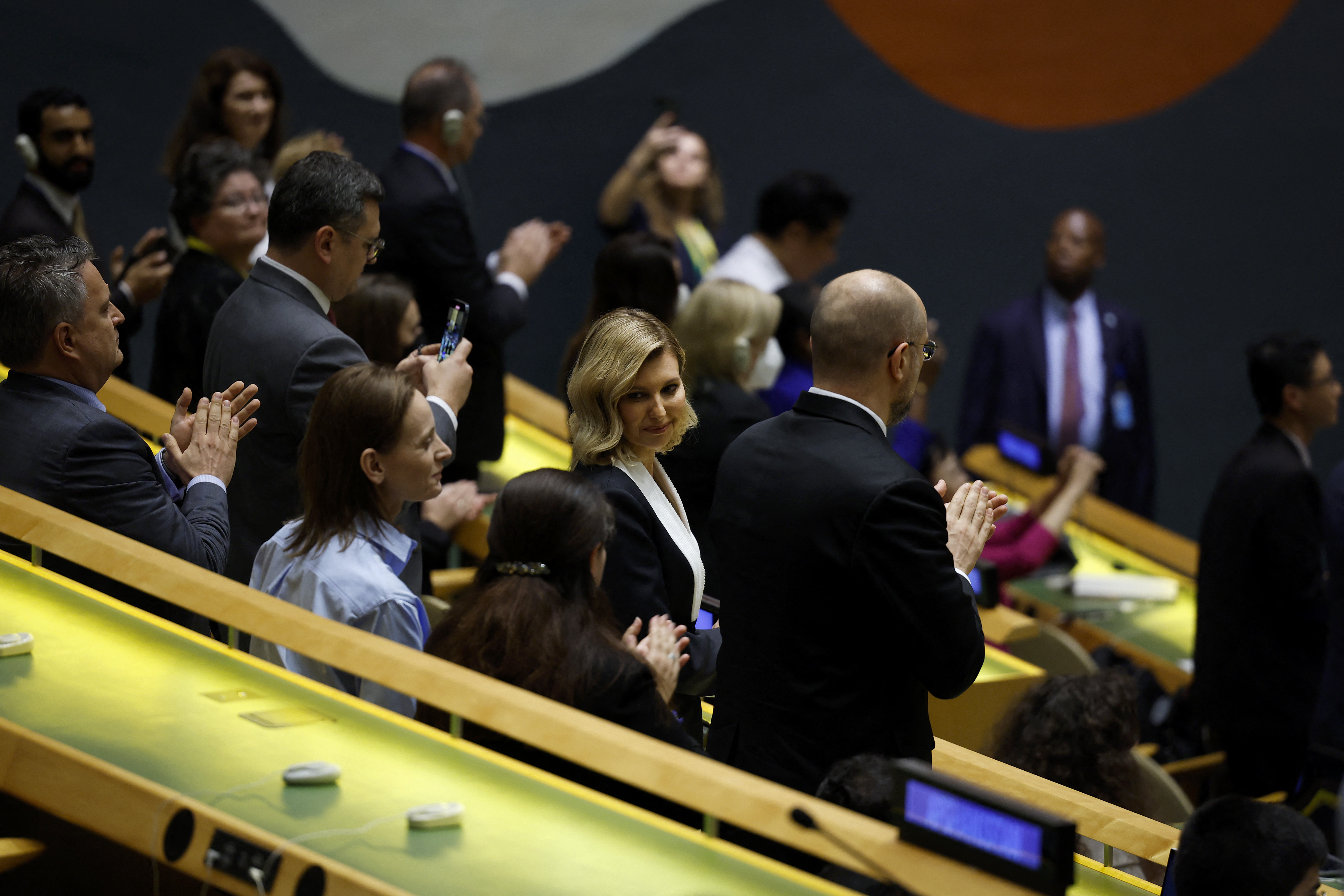 Ukraine's first lady Olena Zelenska stands to applaud among other delegations at the UN following her husband's speech