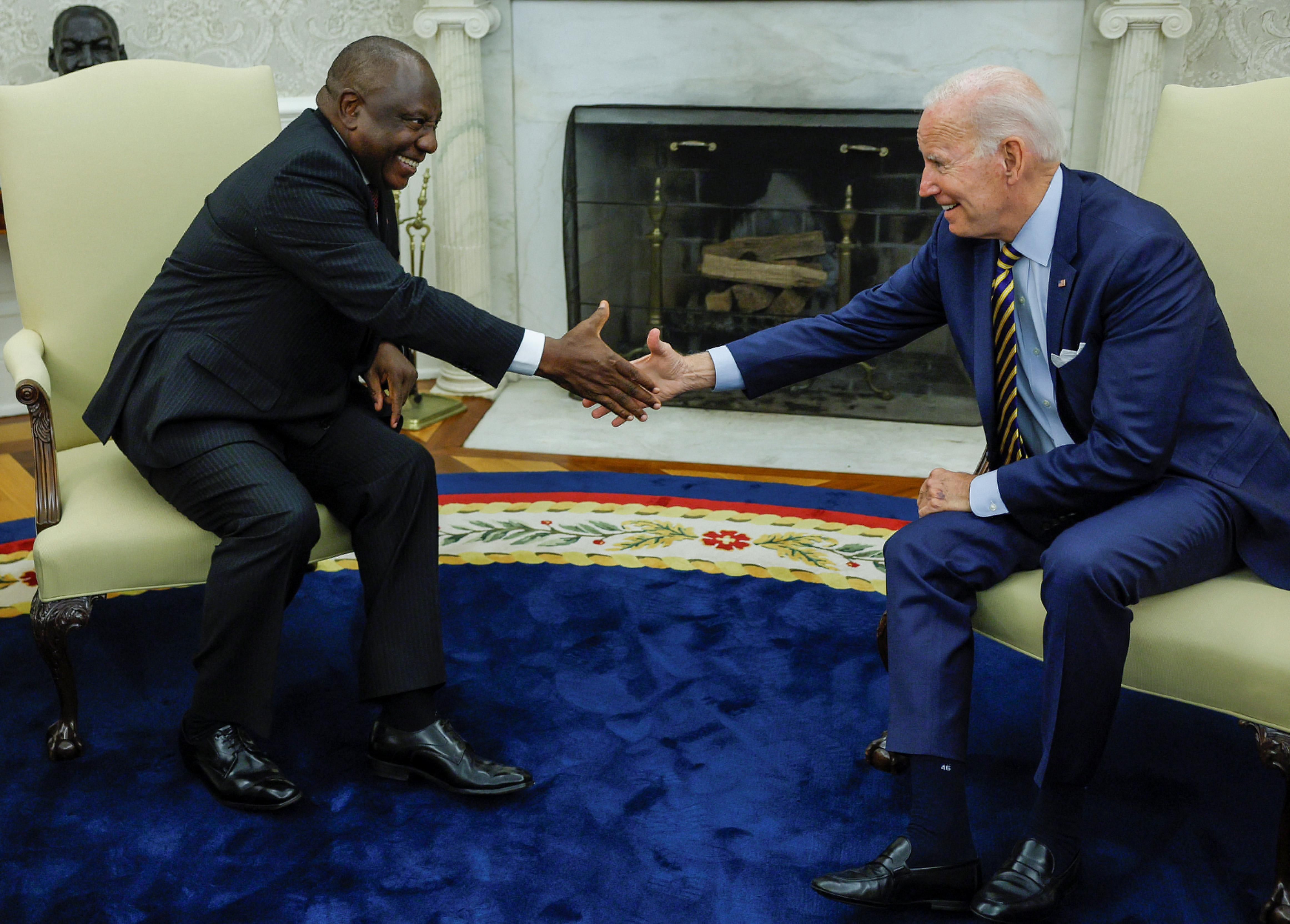 South African President Cyril Ramaphosa shakes hands with US President Joe Biden at the White House