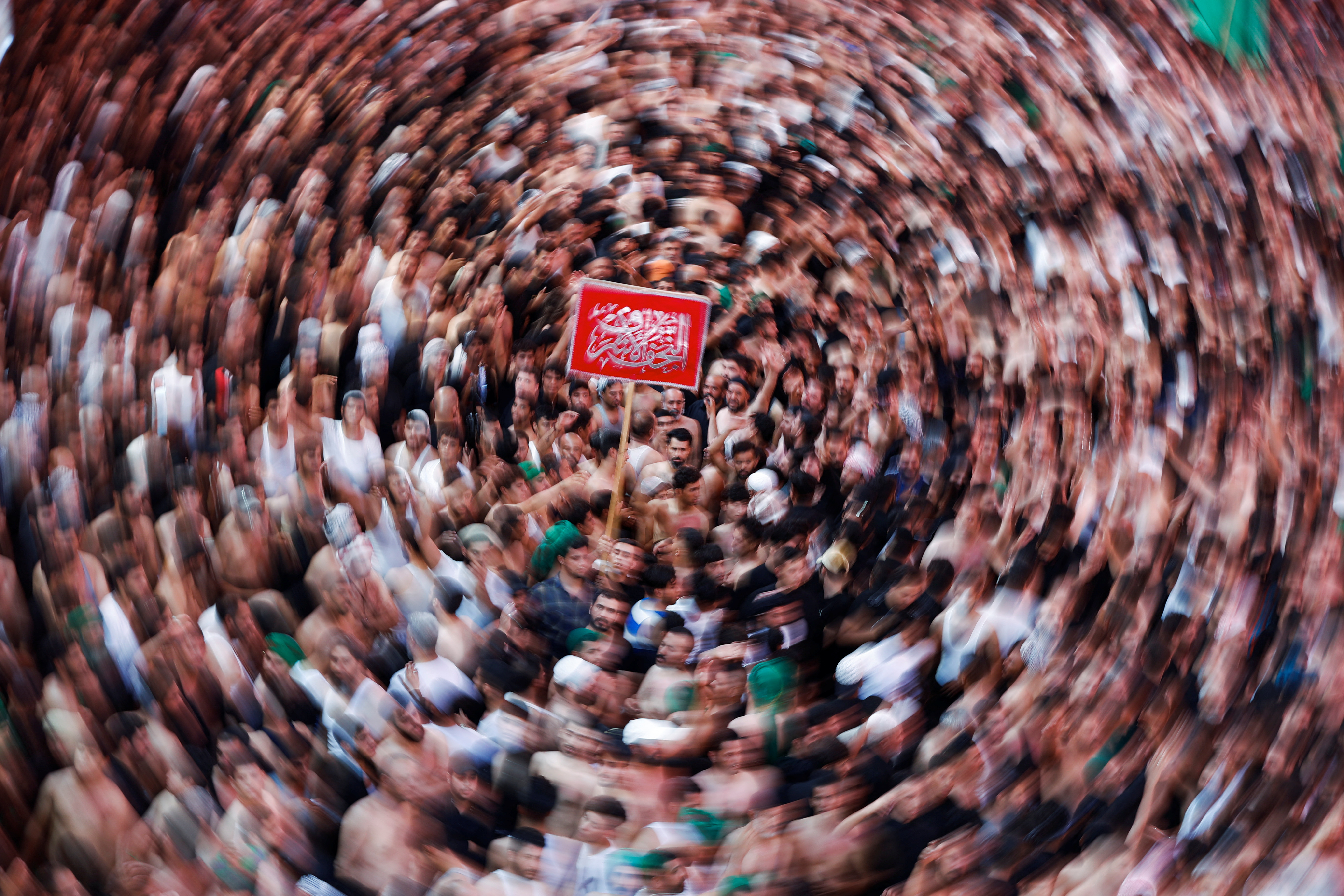 Shia Muslim pilgrims take part in Arbaeen in the holy city of Kerbala.