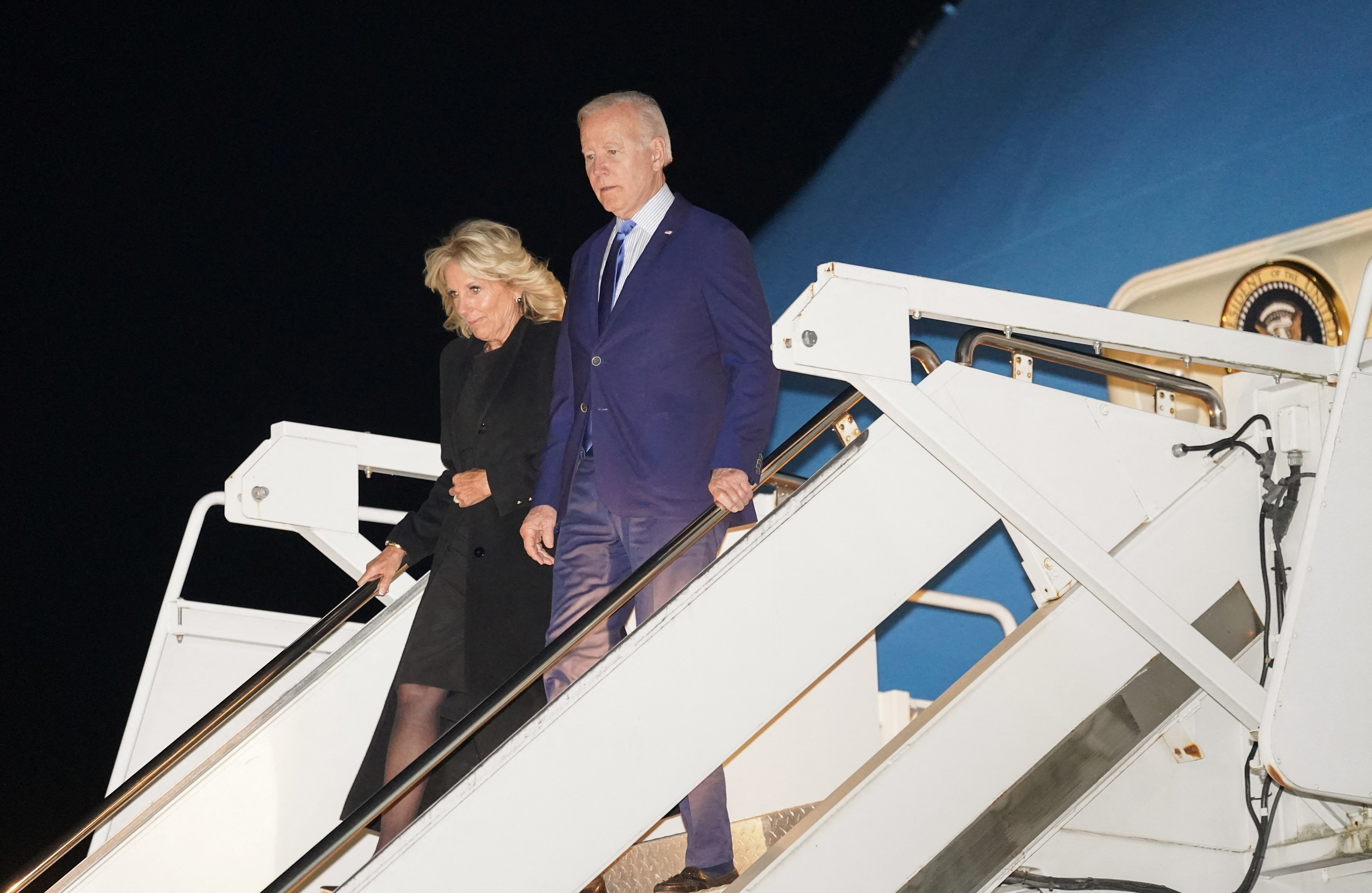 U.S. President Joe Biden and first lady Jill Biden step from Air Force One upon arrival at Stansted Airport to attend Monday’s funeral of Britain's Queen Elizabeth in London, Britain, September 17, 2022.