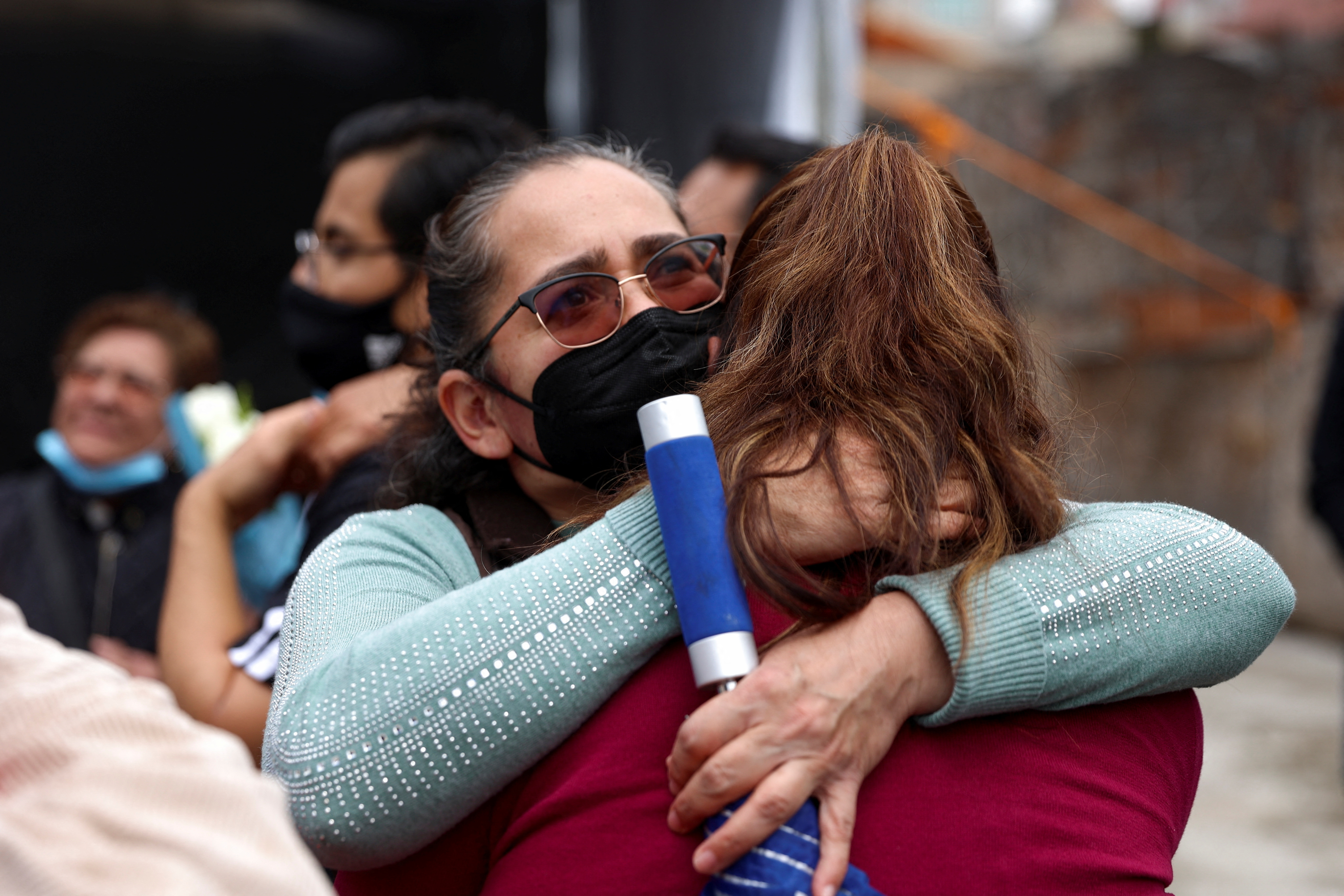 People attending an event to honor the children who died in the Enrique Rebsamen school during an earthquake in 2017, react as another earthquake is felt in Mexico City