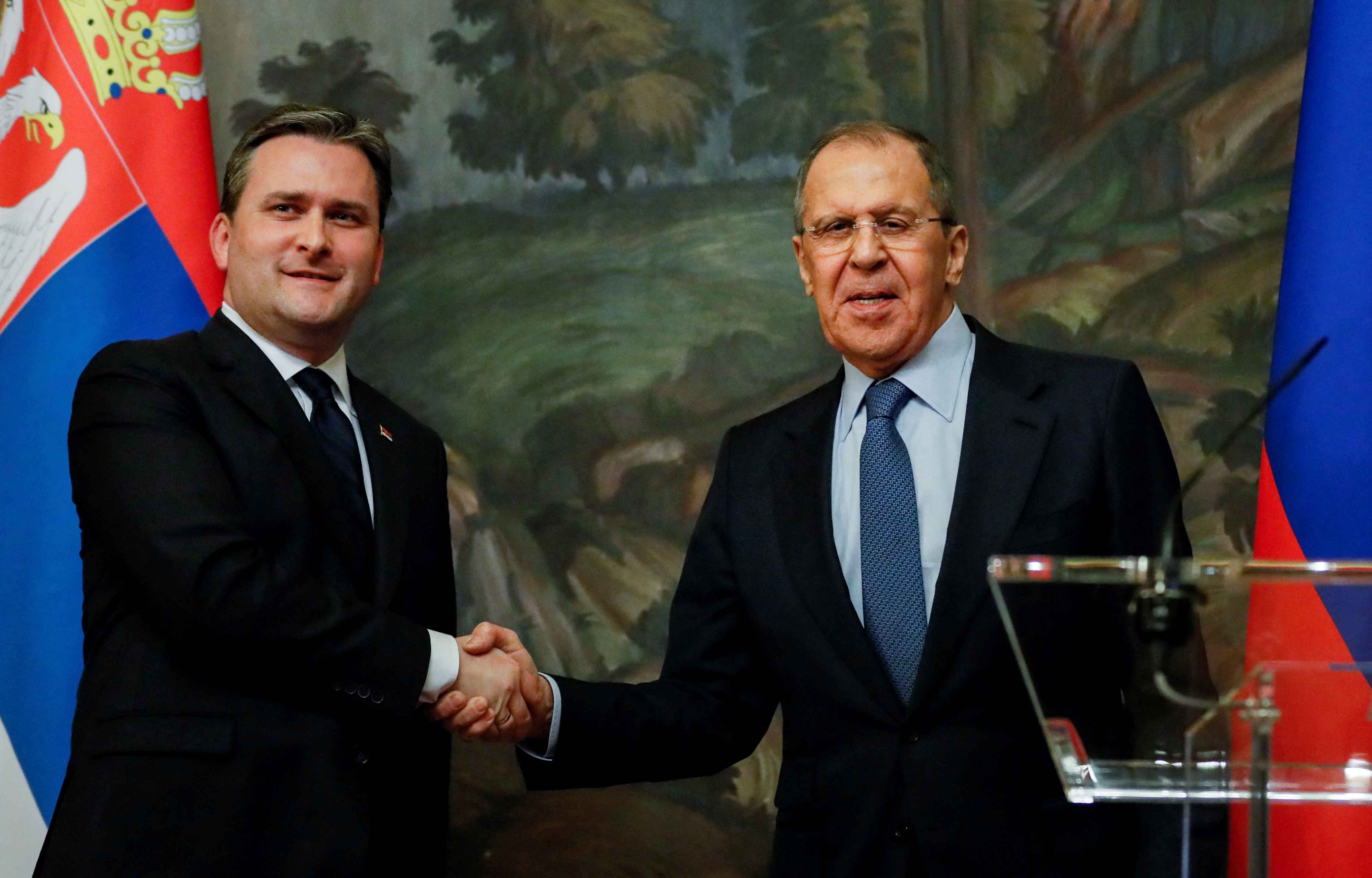 Russian Foreign Minister Sergei Lavrov shakes hands with Serbian Foreign Minister Nikola Selakovic