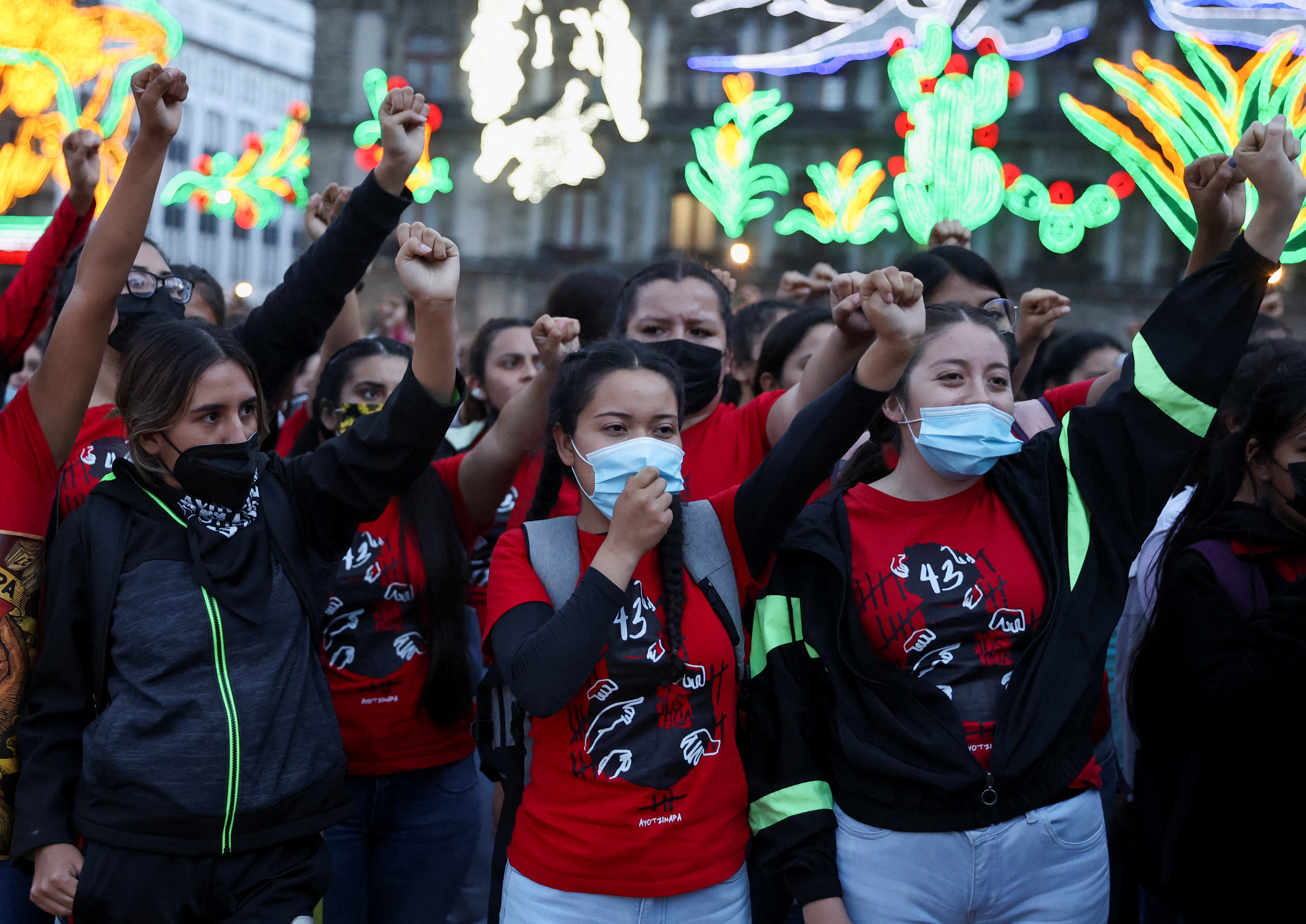 People march to mark eight-year anniversary of Mexican students' disappearances