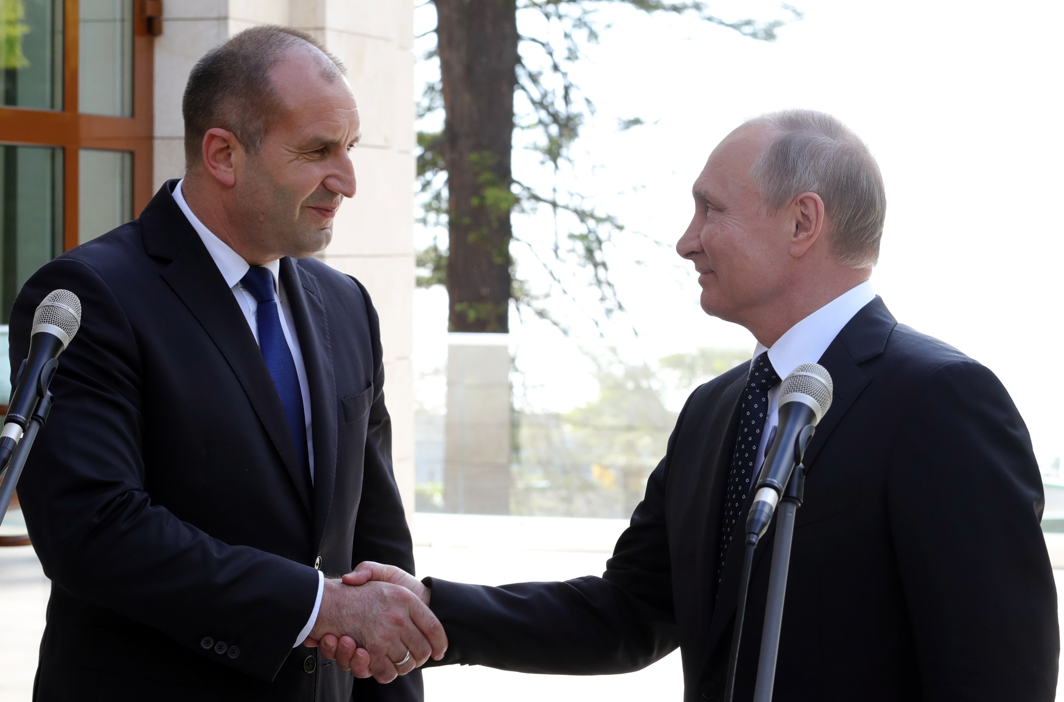 Russian President Vladimir Putin, right, shakes hands with Bulgarian President Rumen Radev after their talks in the Bocharov Ruchei residence in the Black Sea resort of in Sochi, Russia, Tuesday, May 22, 2018. (AP Photo/Alexander Zemlianichenko)