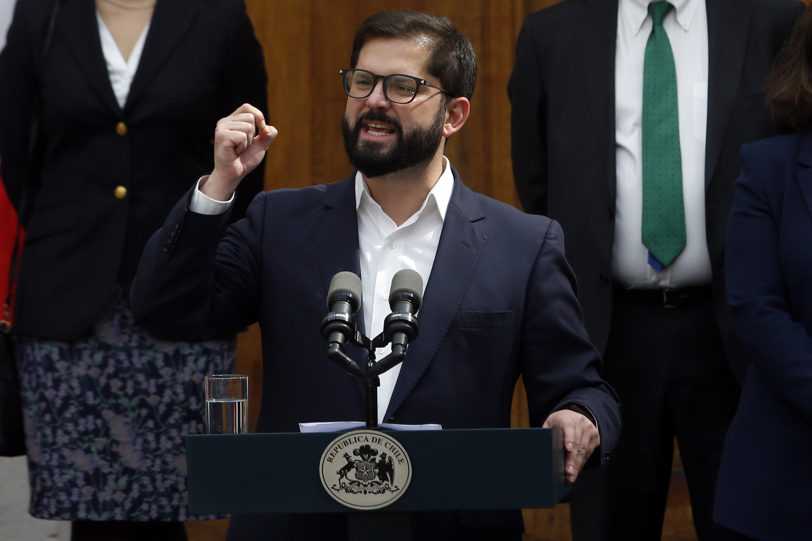 Chile's President Gabriel Boric speaks at a lectern during a ceremony at the presidential palace in Santiago, Chile.