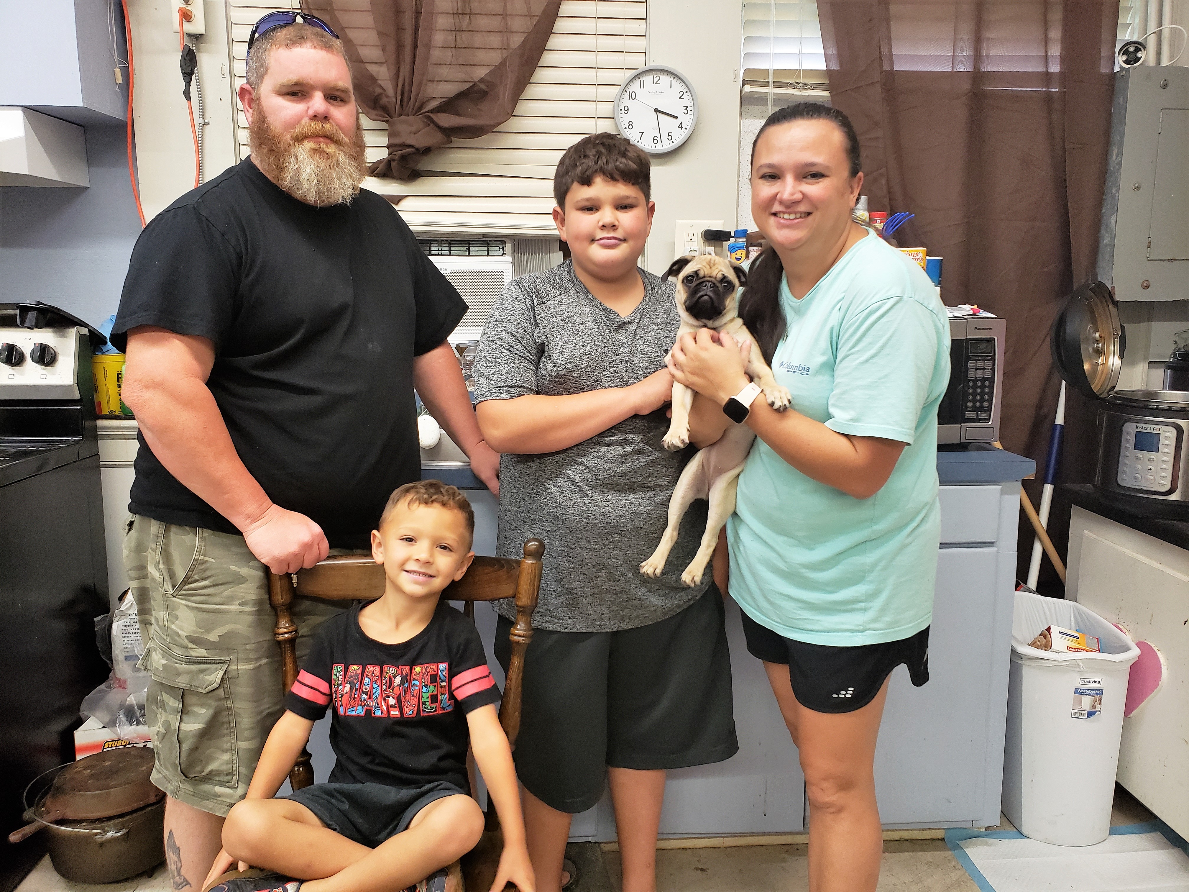 A photo of the Morrises, from left: Joshua, Ashton, Gracie, Danielle, and Josaiah (seated).