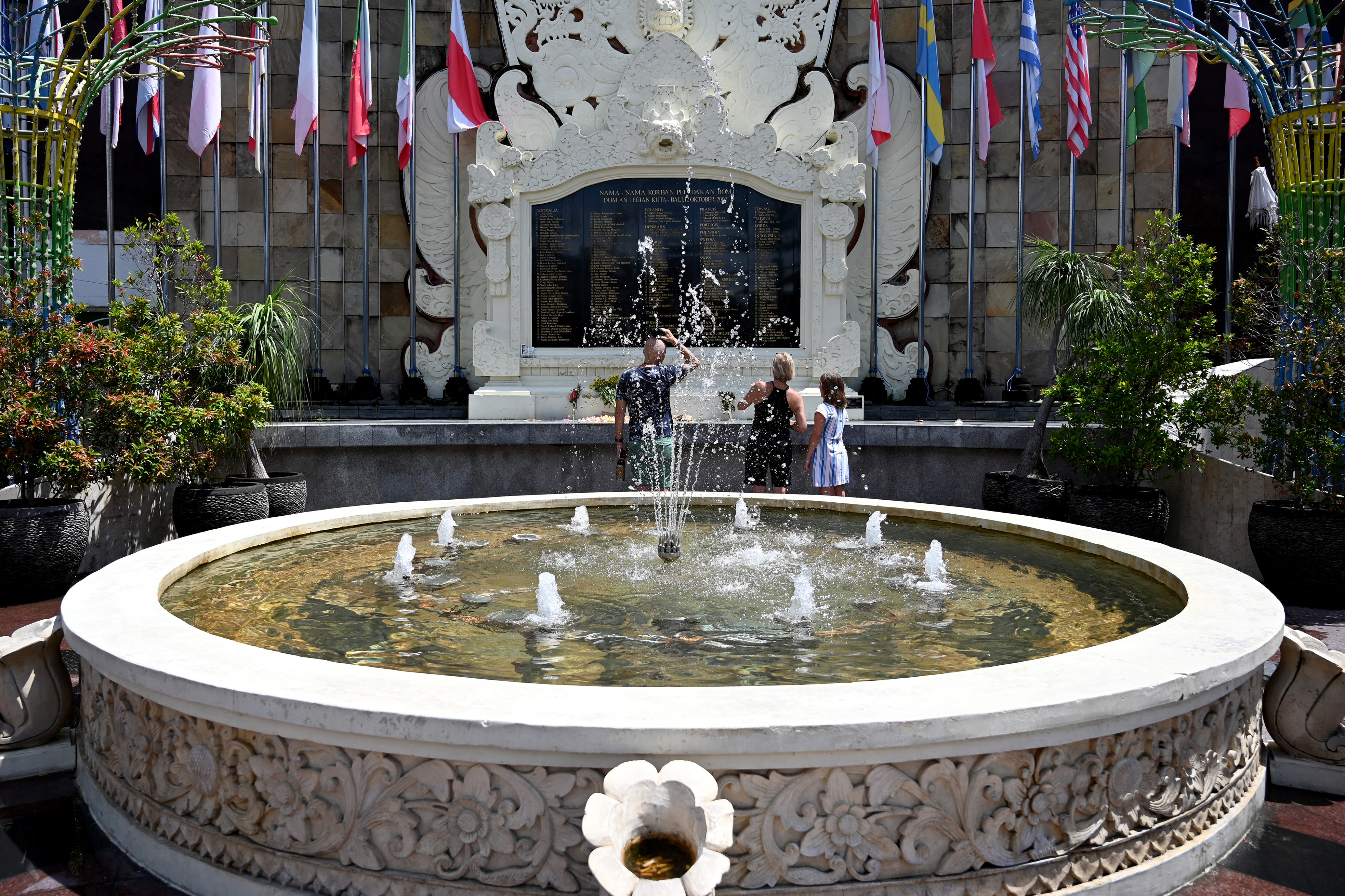 The fountain and stone monument inscribed with the names of the 202 people who died 
