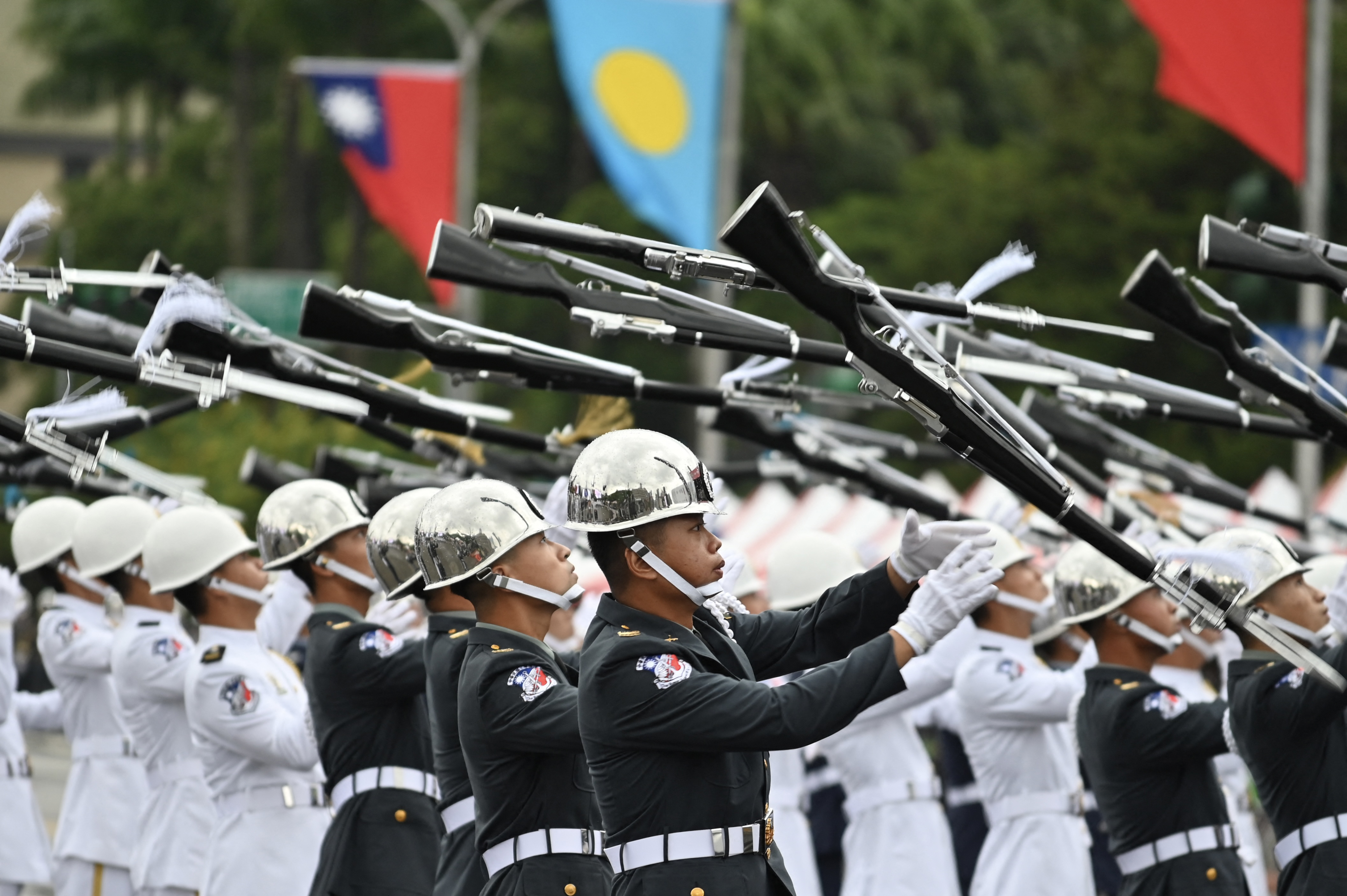 A Taiwanese honour guard performs to mark the island’s national day in front of the Presidential Office in Taipei