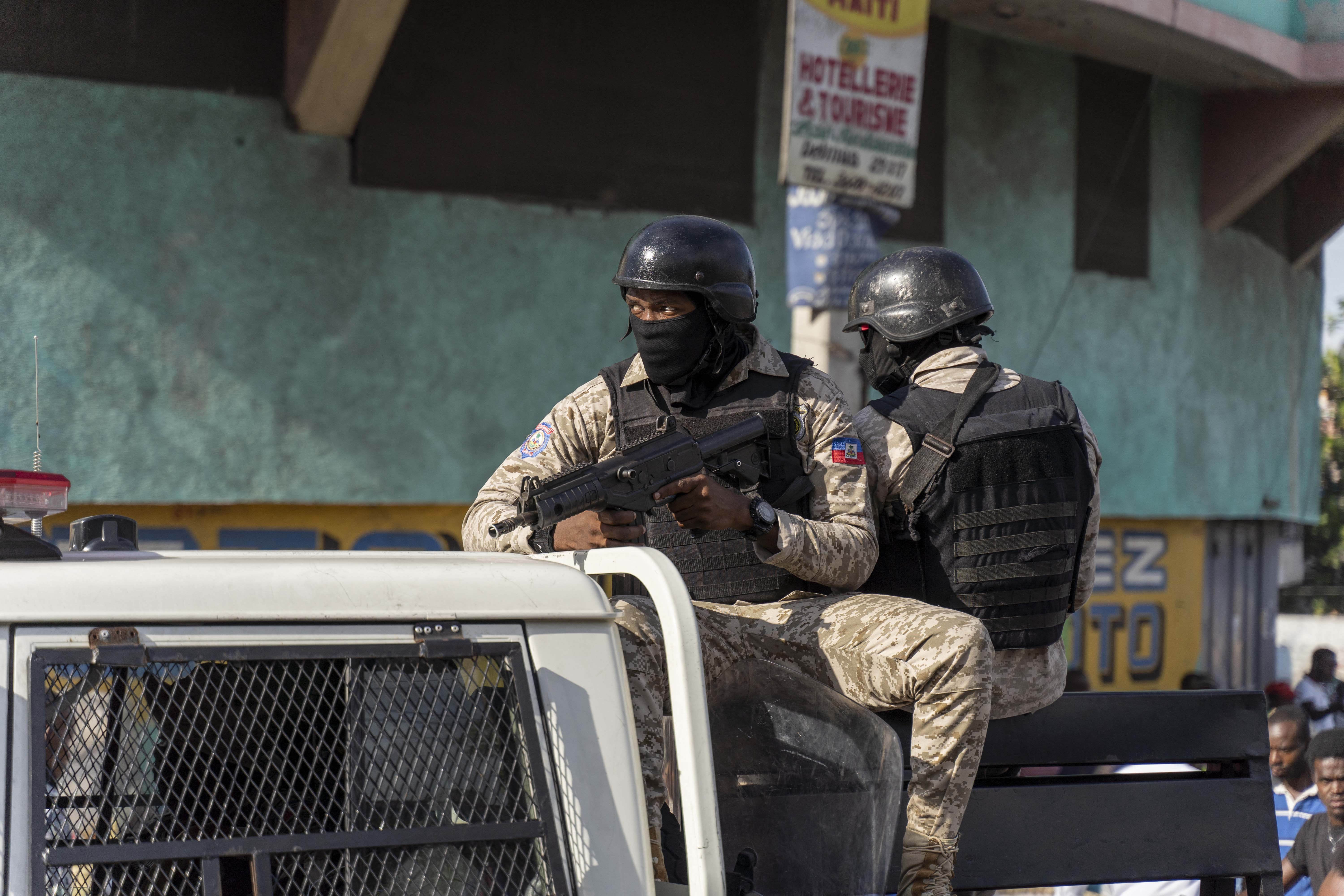 Police forces patrol the streets during a demonstration against Haitian Prime Minister Ariel Henry and the United Nations amid a health and security crisis in Port-au-Prince on October 21, 2022.