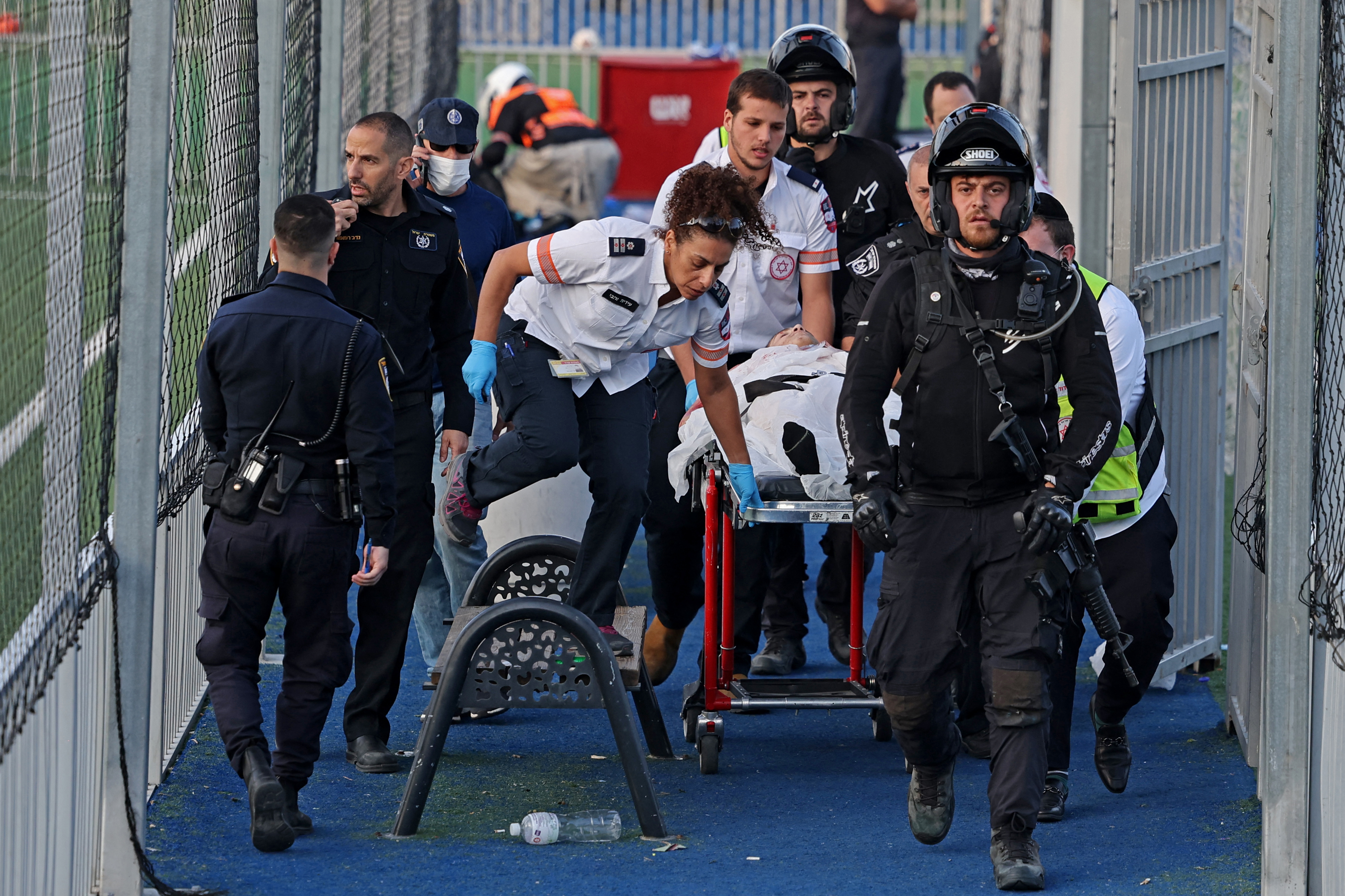 Israeli forces carry Palestinian man