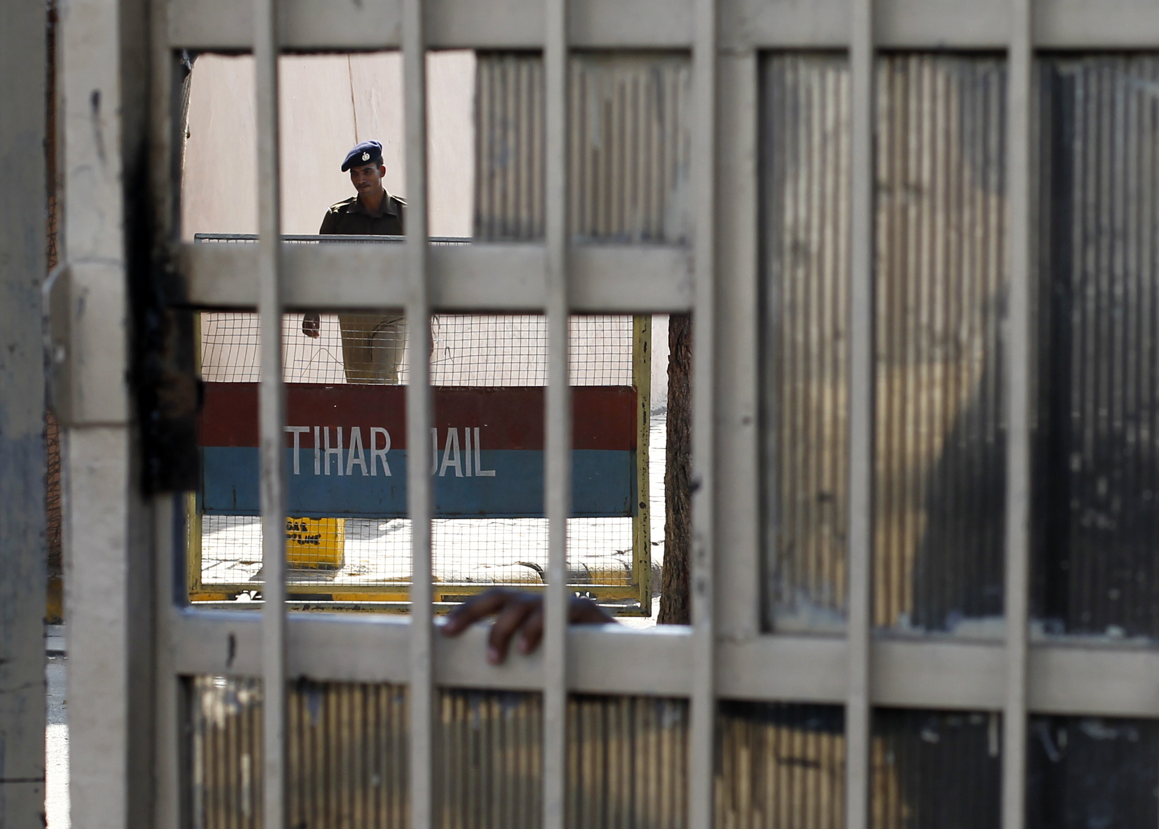 A policeman walks inside the Tihar Jail in New Delhi March 1