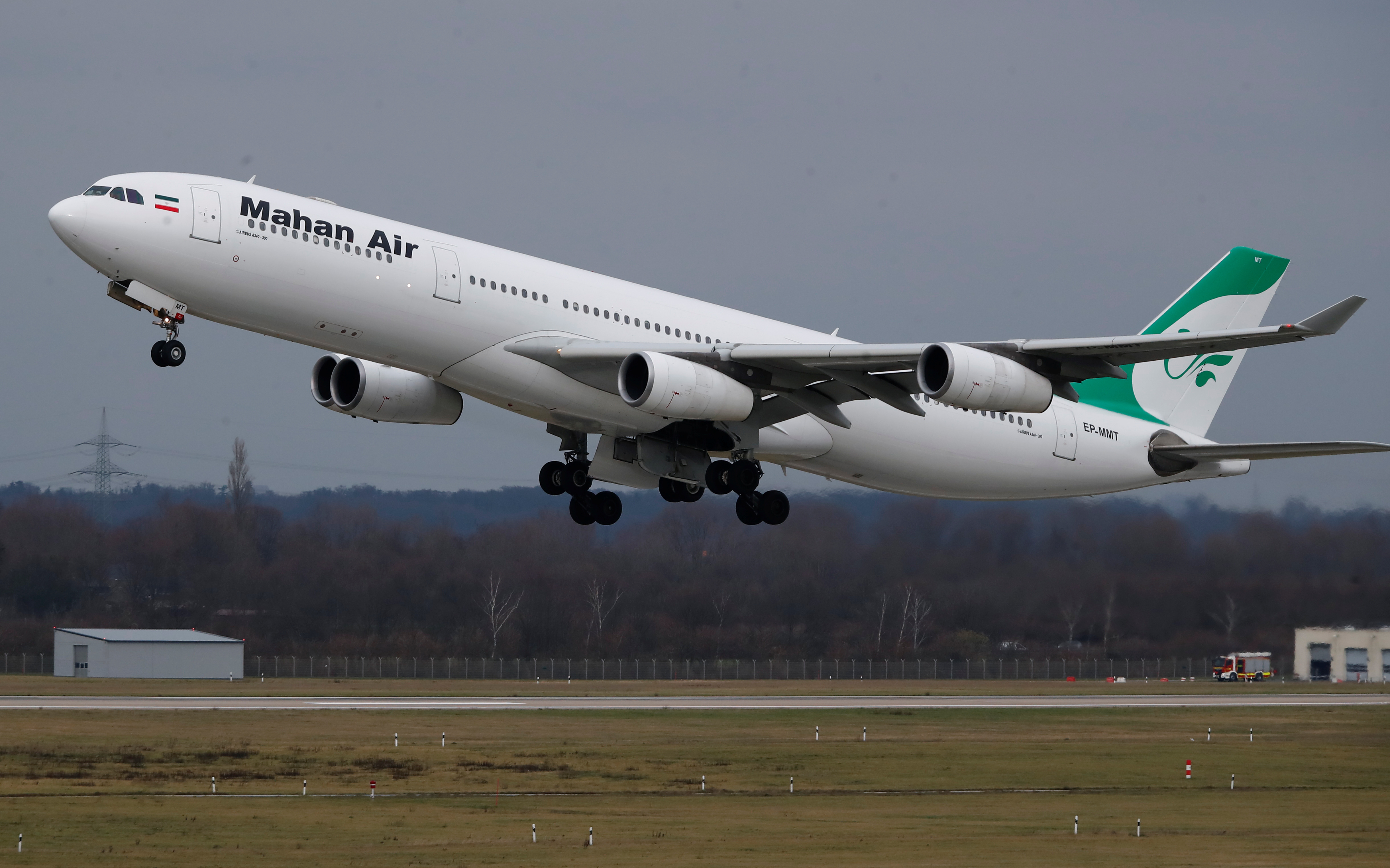 An Airbus A340-300 of Iranian airline Mahan Air takes off from Duesseldorf airport DUS, Germany.