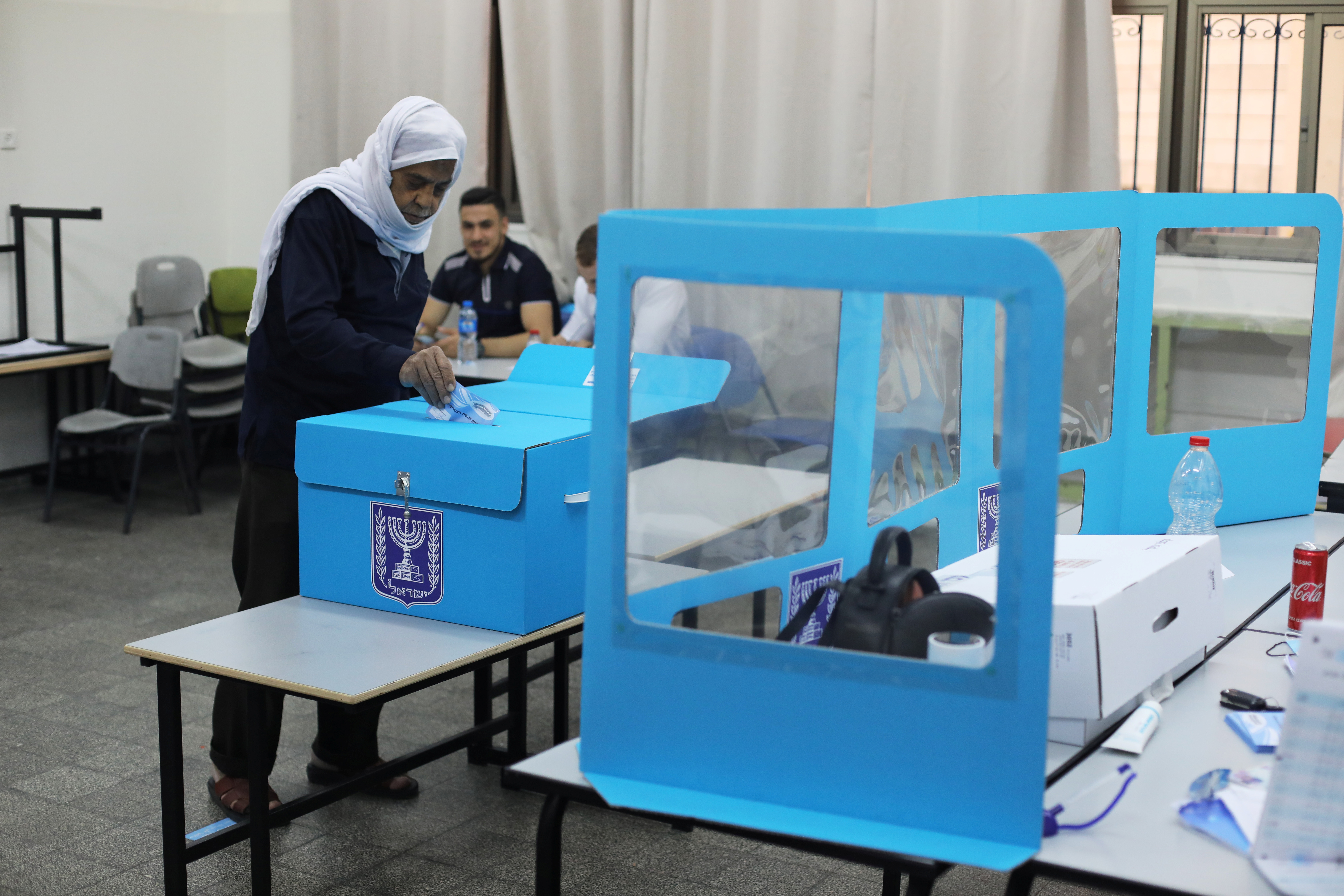 An Arab-Israeli man casts his ballot as he votes in Israel's general election, in Kafr Manda, northern Israel March 23, 2021. REUTERS/Ammar Awad