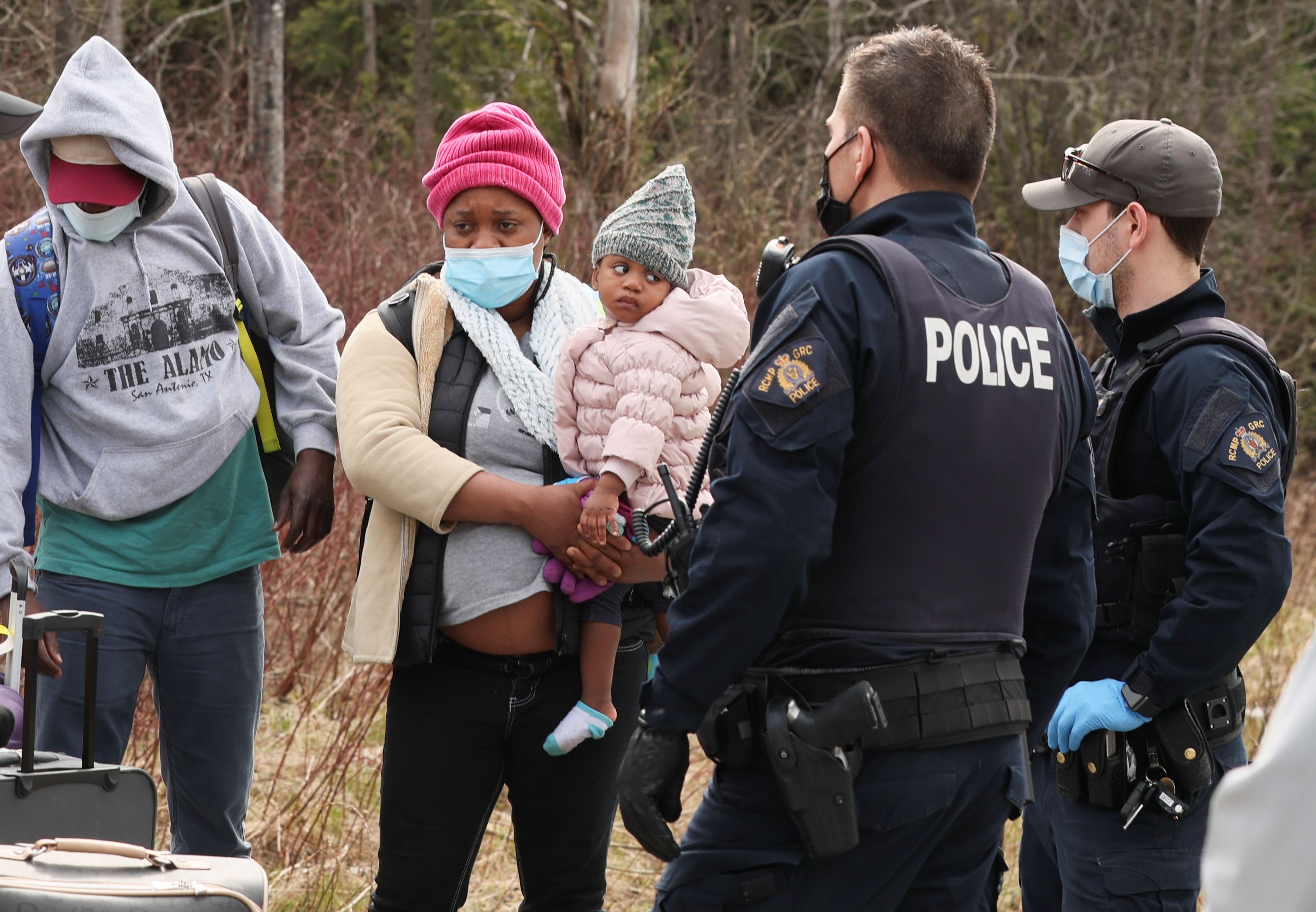 Asylum seekers cross into Canada from the US border