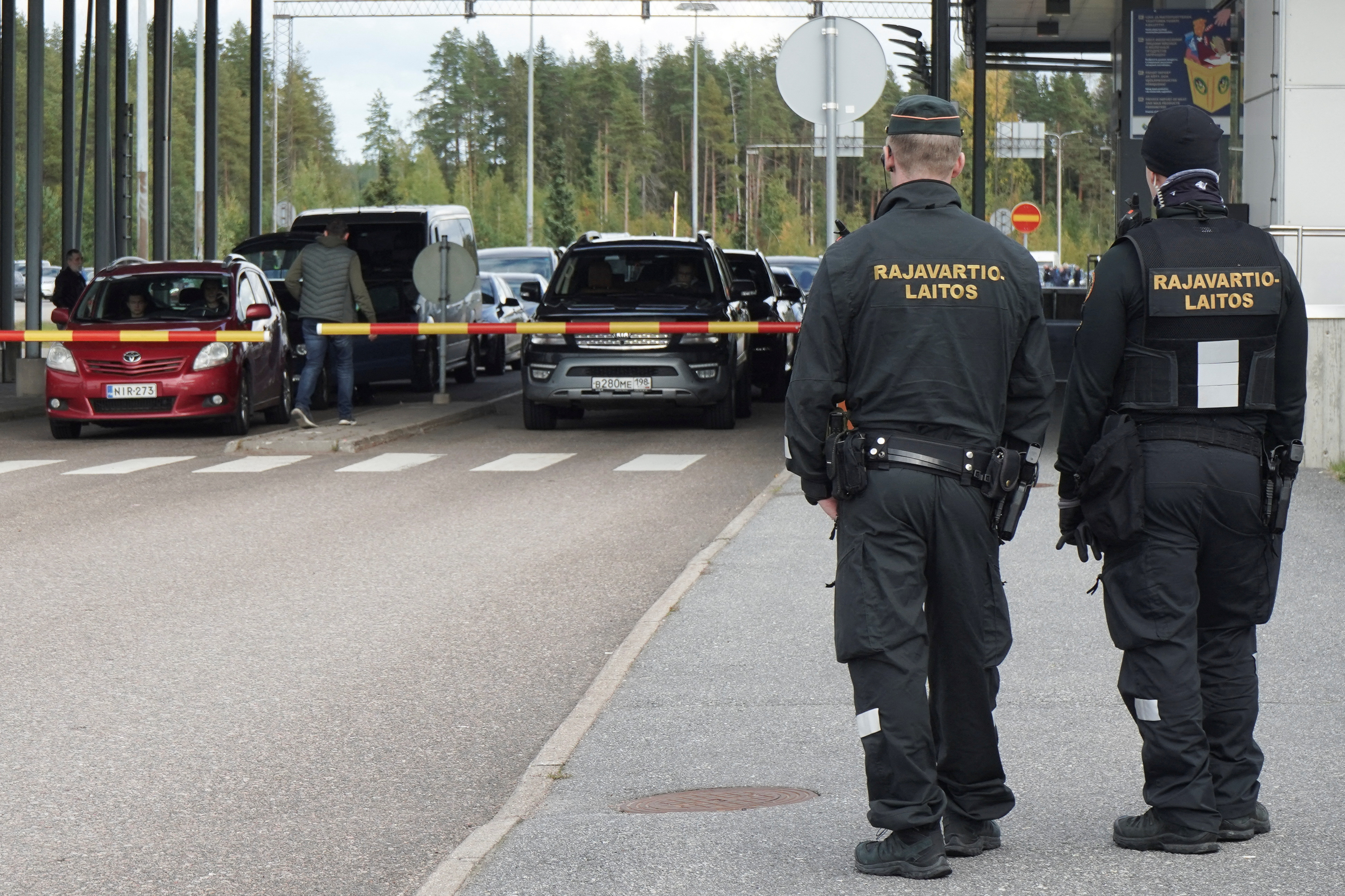 Cars queue to enter Finland from Russia at Finland's most southern crossing point Vaalimaa