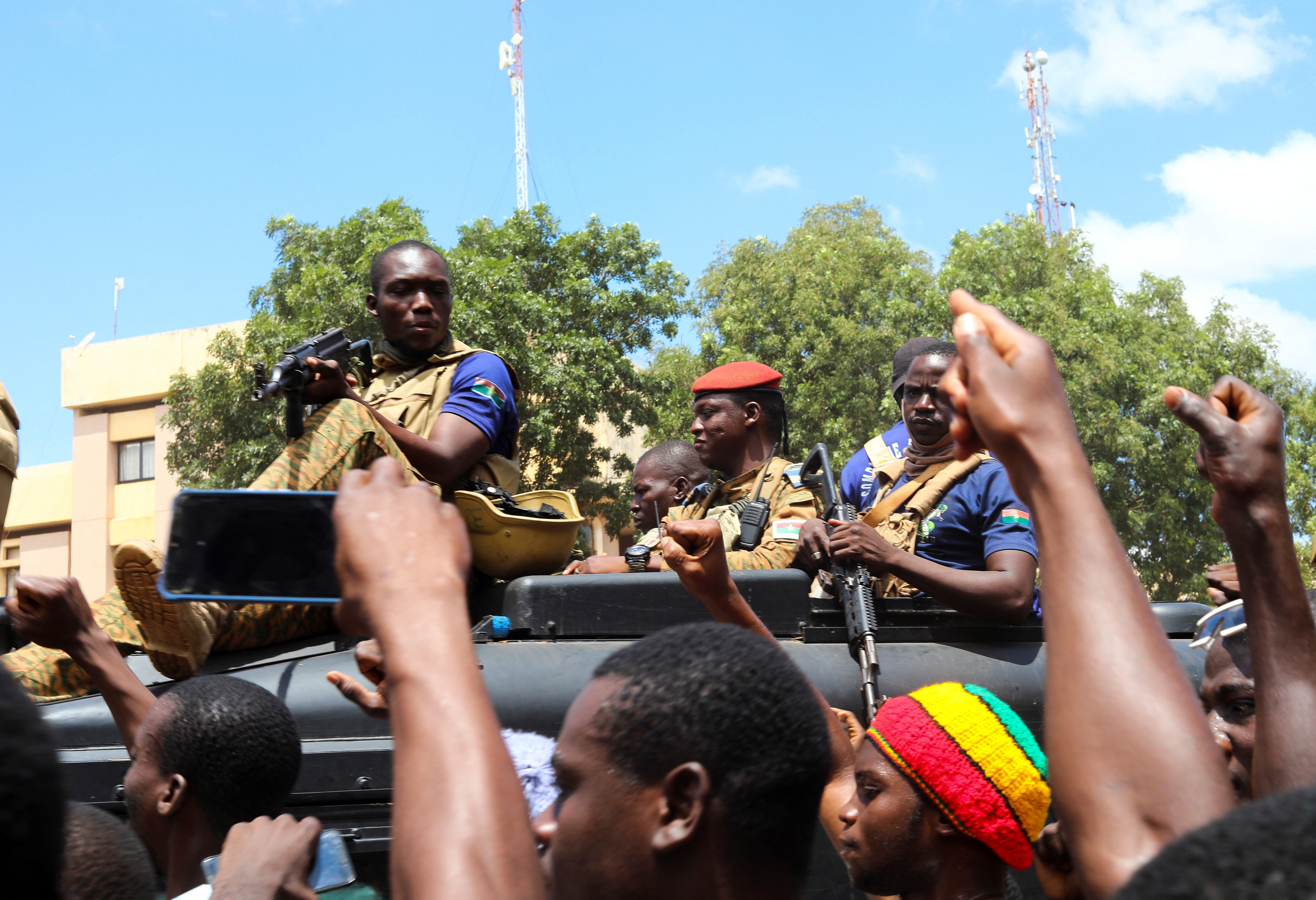 Burkina Faso's new military leader Ibrahim Traore is escorted by soldiers while he stands in an armoured vehicle in Ouagadougou, Burkina Faso October 2, 2022.