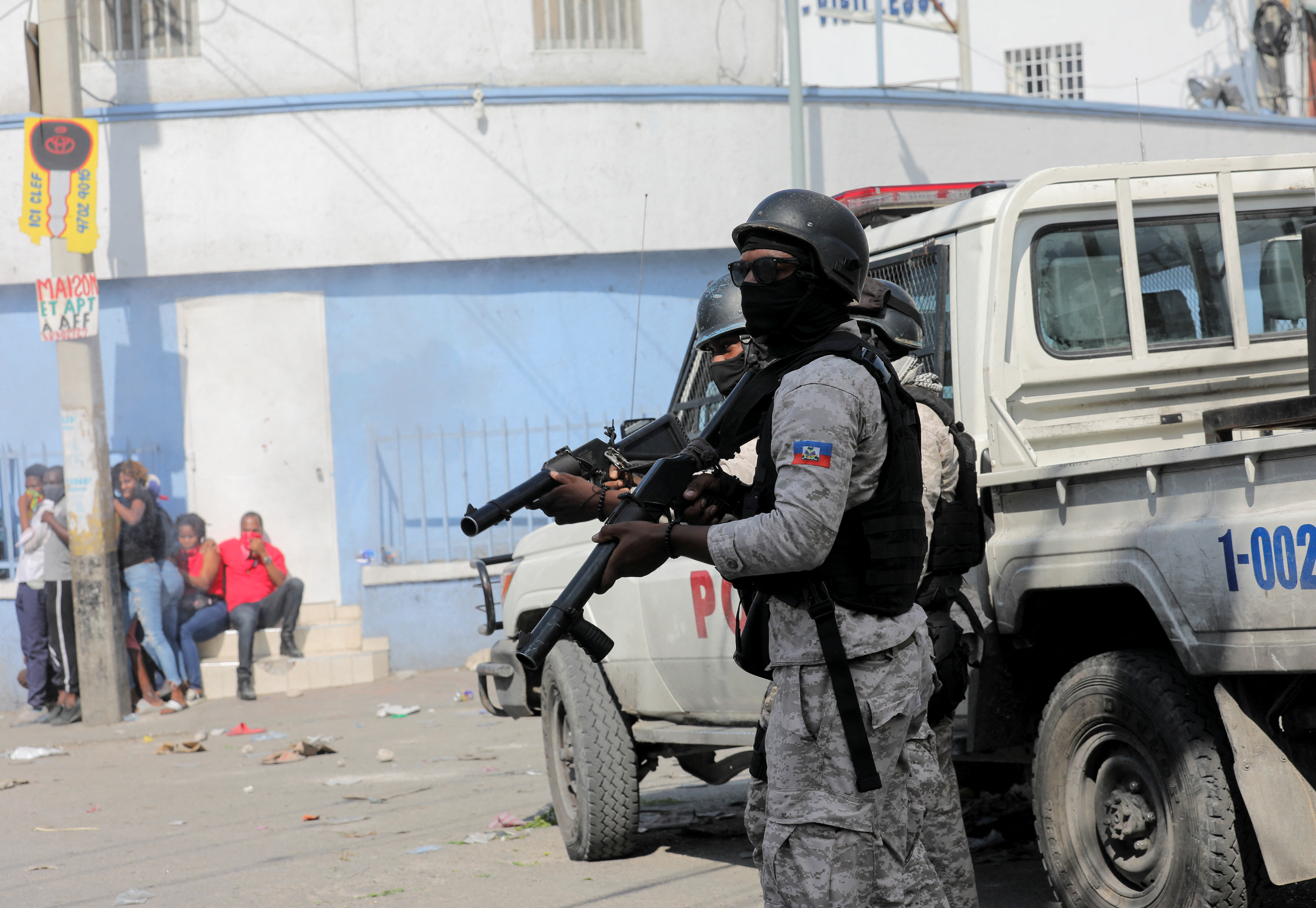 Police block a street during a protest against the government and rising fuel prices, in Port-au-Prince, Haiti