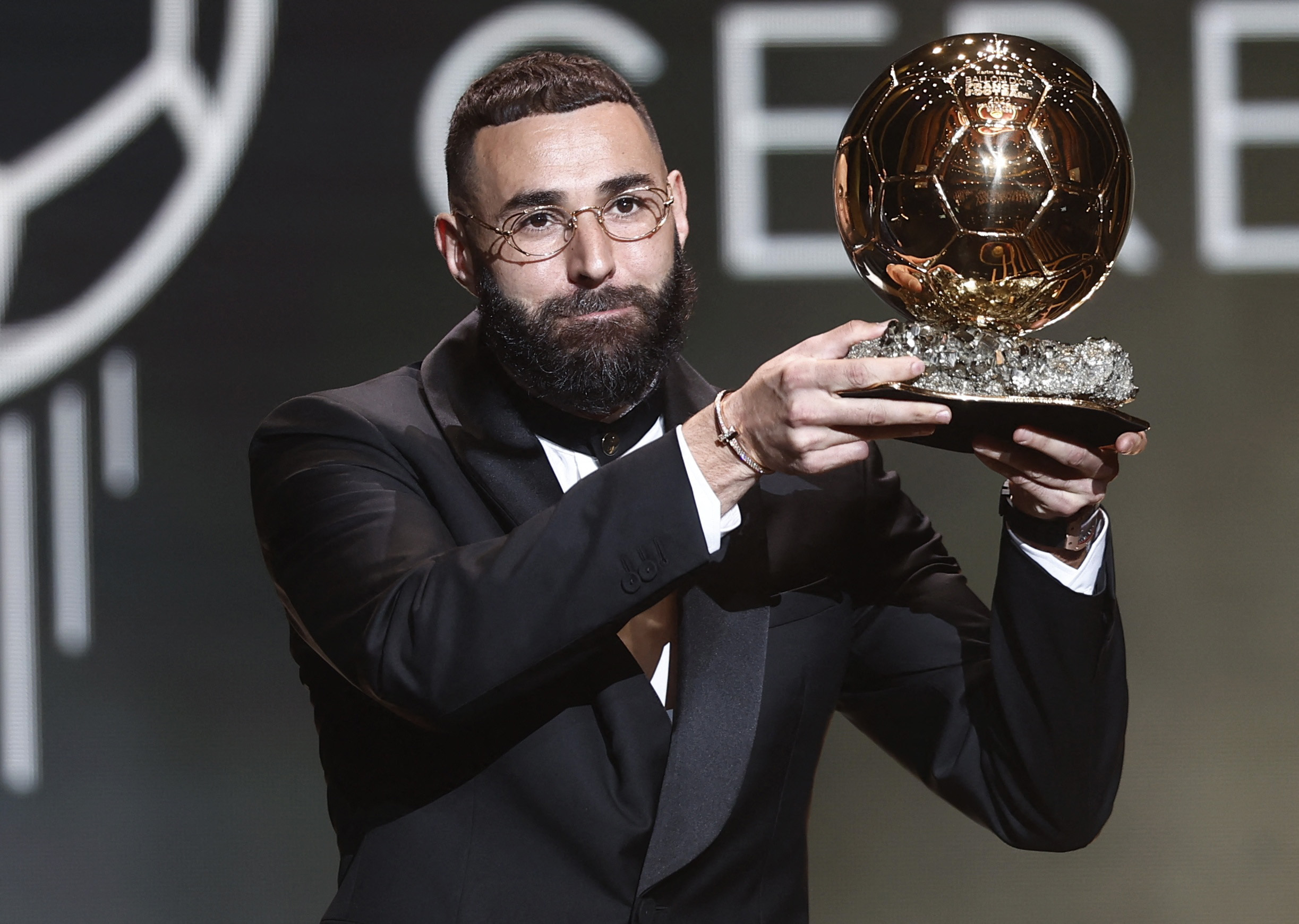 Real Madrid's Karim Benzema holding up the Ballon d'Or.