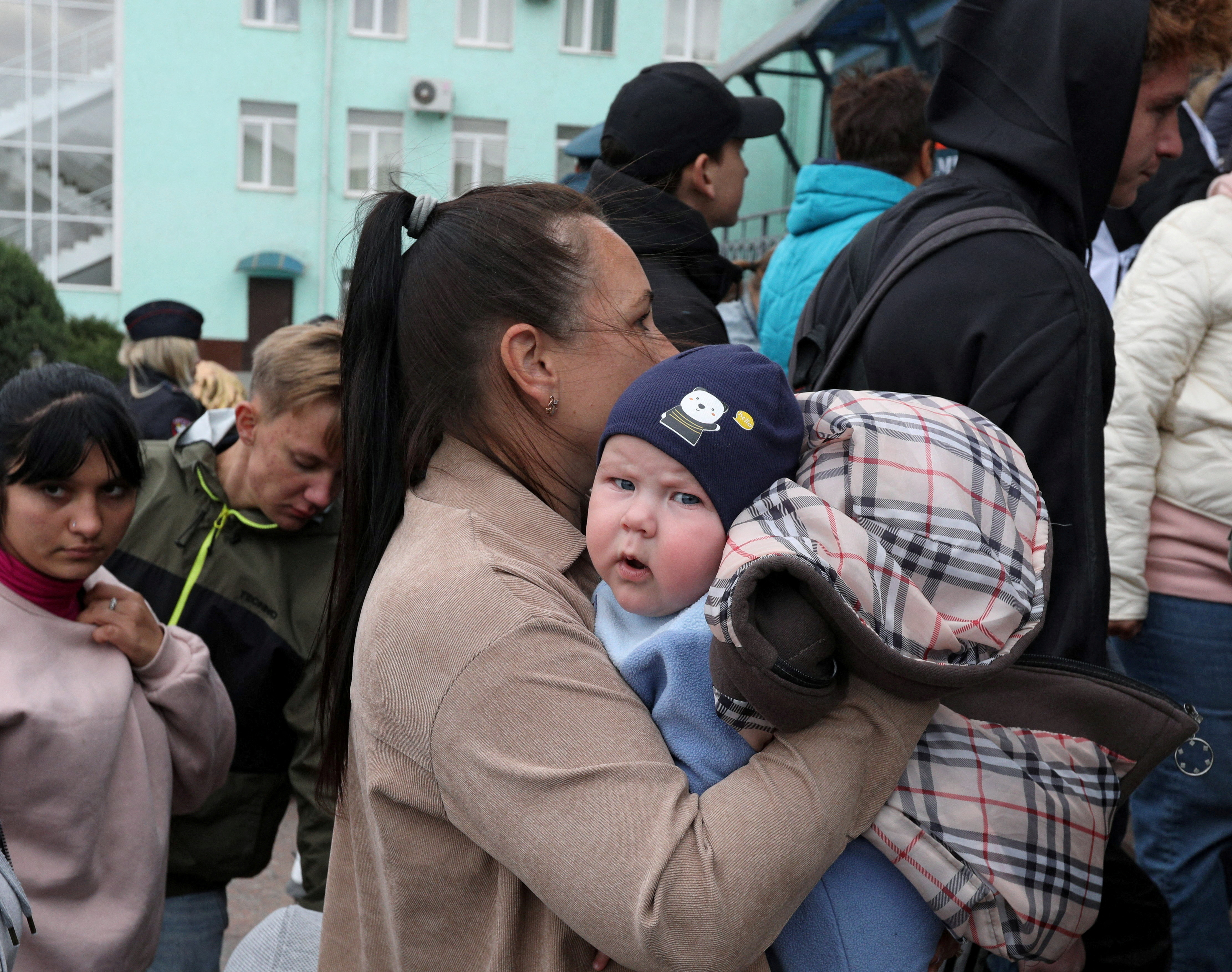 Civilians evacuated from the Russian-controlled Kherson region of Ukraine arrive at a railway station in the town of Dzhankoi, Crimea October 20, 2022. REUTERS/Alexey Pavlishak TPX IMAGES OF THE DAY
