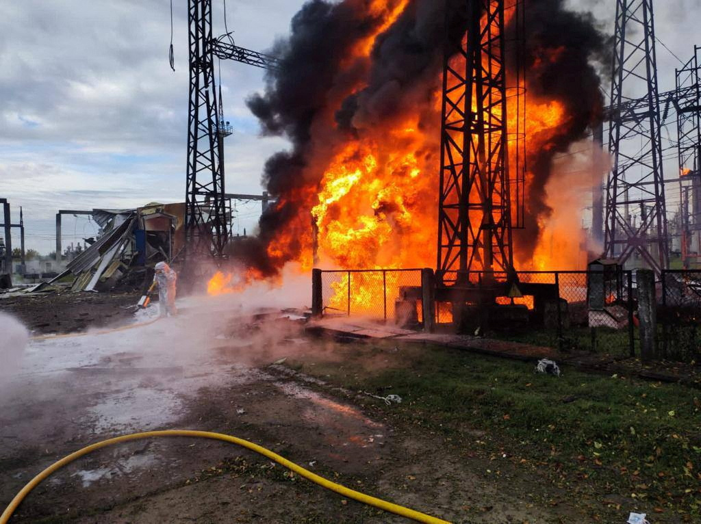 Firefighters work to put out a fire at energy infrastructure facilities, damaged by a Russian missile strike, as Russia's attack on Ukraine continues, in an undisclosed location, Ukraine October 22, 2022