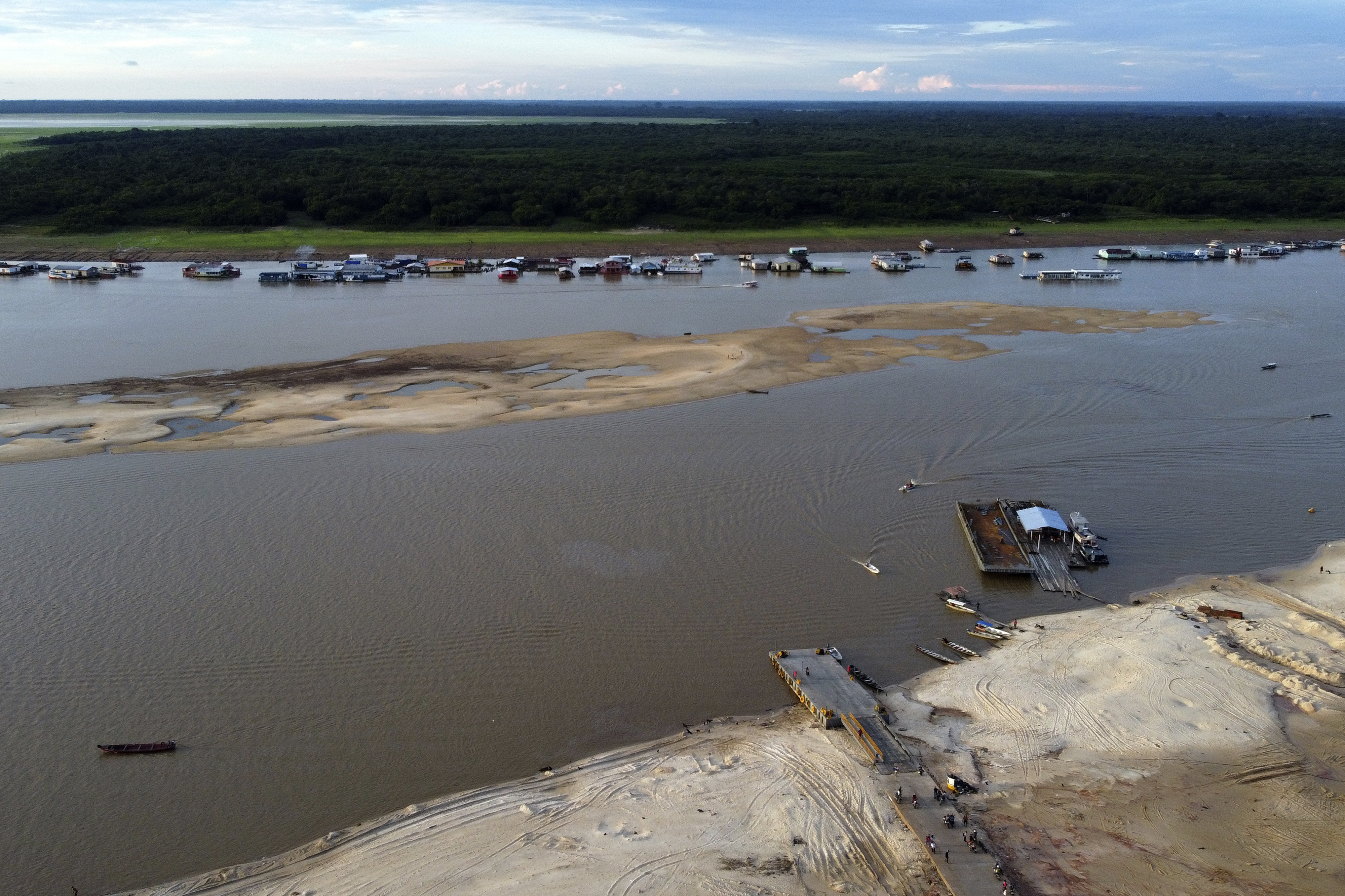 A boat dock sits amid drought-impacted land near the Solimões River, in Tefe, Amazonas state, Brazil