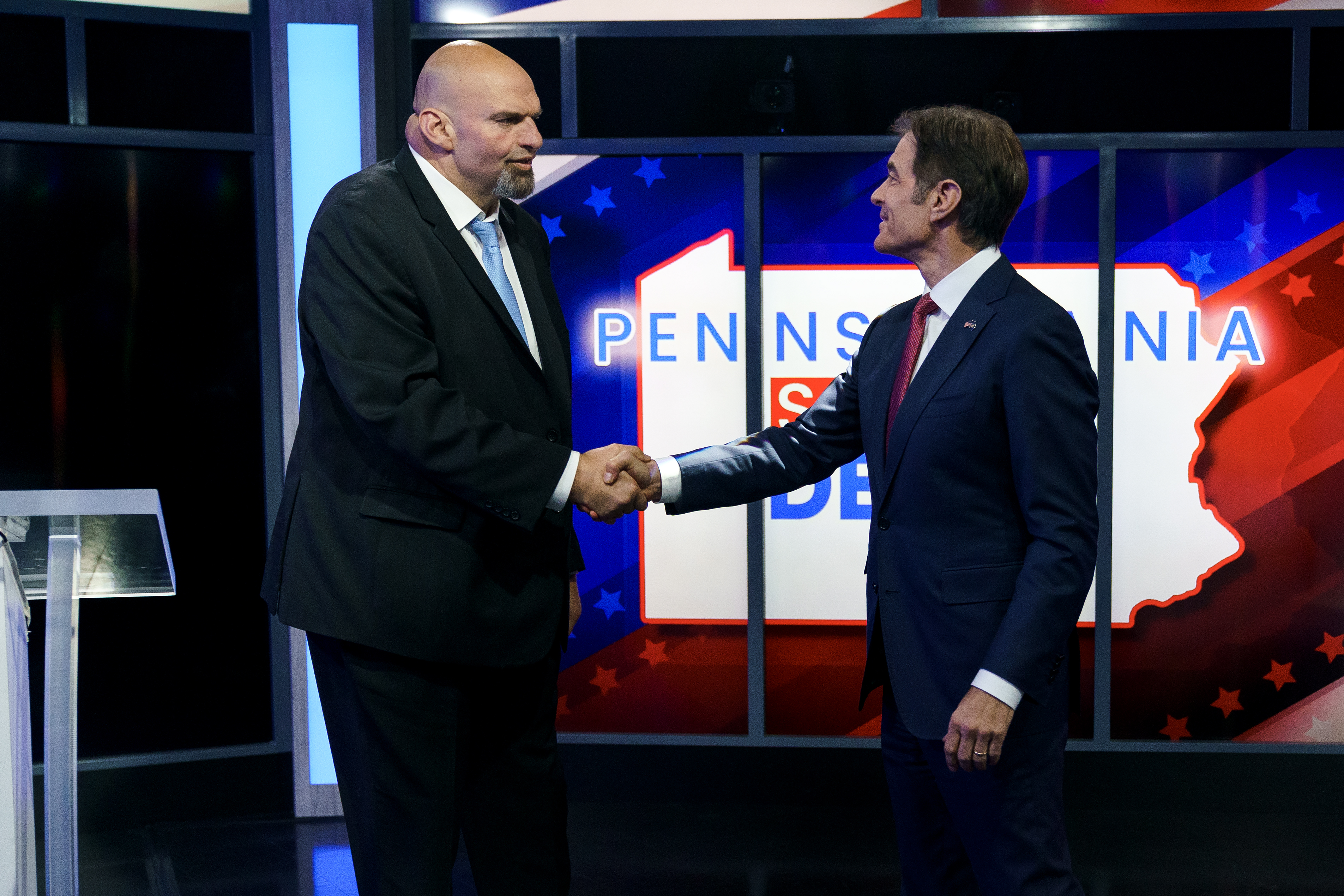 epa10266301 A handout photo made available by abc27 shows Democratic candidate Lt. Gov. John Fetterman (L) and Republican Pennsylvania Senate candidate Dr. Mehmet Oz (R) shaking hands prior to the Nexstar Pennsylvania Senate Debate at WHTM abc27 in Harrisburg, Pennsylvania, USA, 25 October 2022.