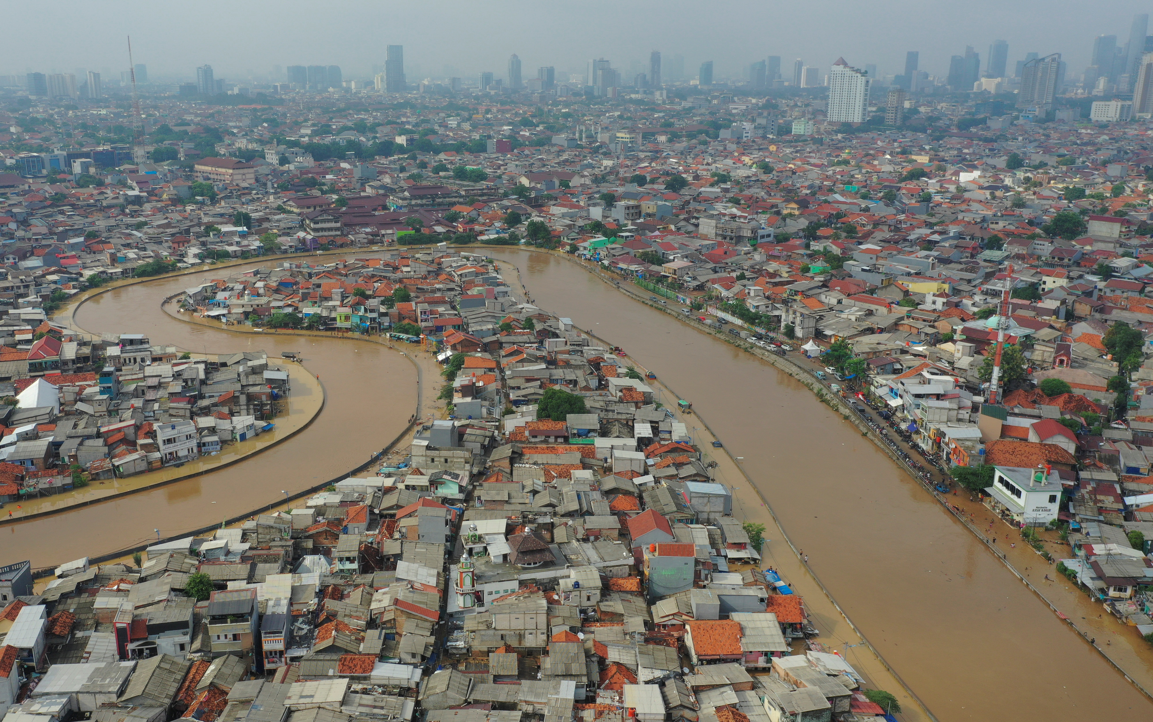 Skyline shot of an area affected by floods, next to Ciliwung river in Jakarta, Indonesia.