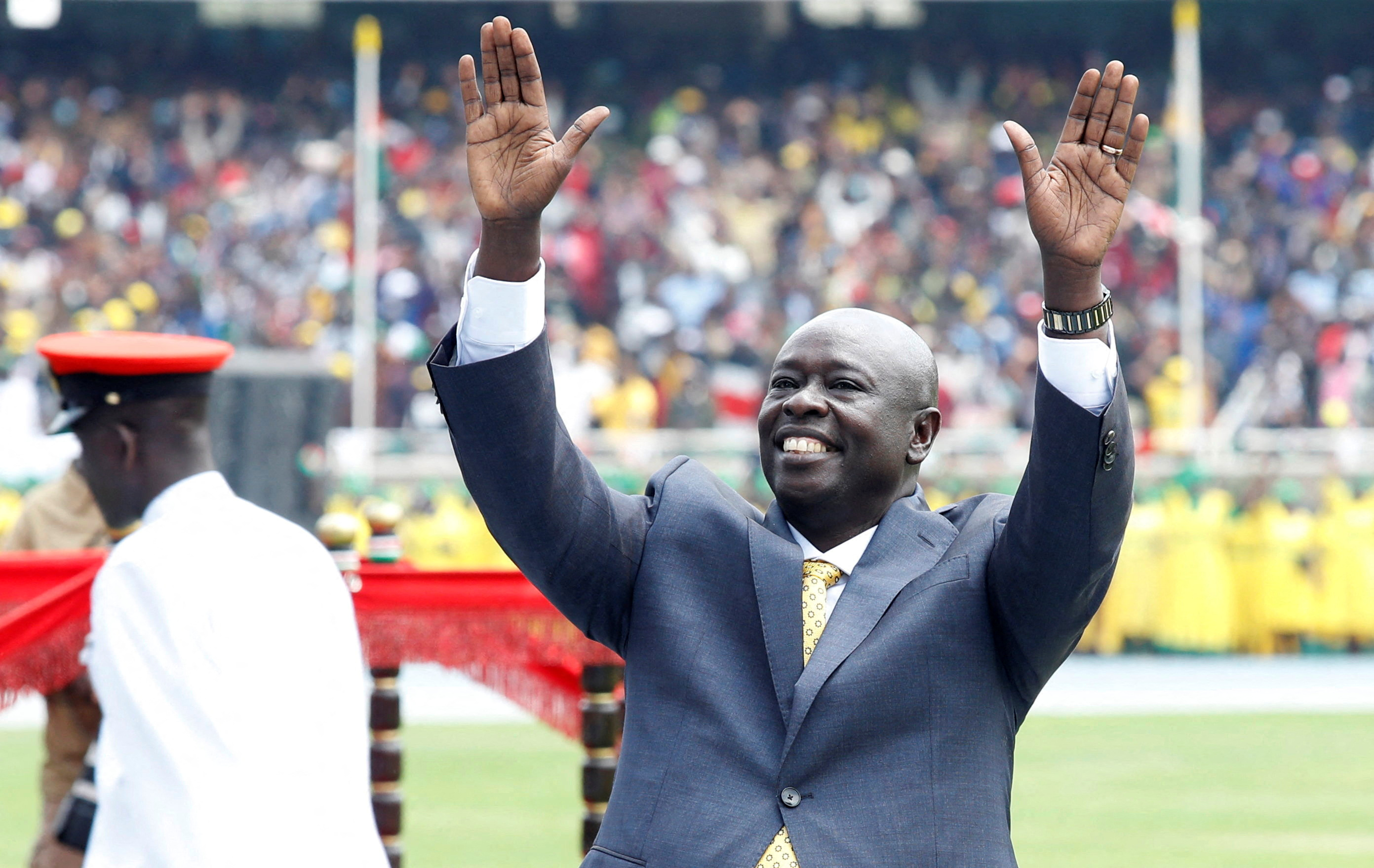 Kenya's deputy President Rigathi Gachagua waves to supporters as he arrives for his swearing-in ceremony in Nairobi, Kenya
