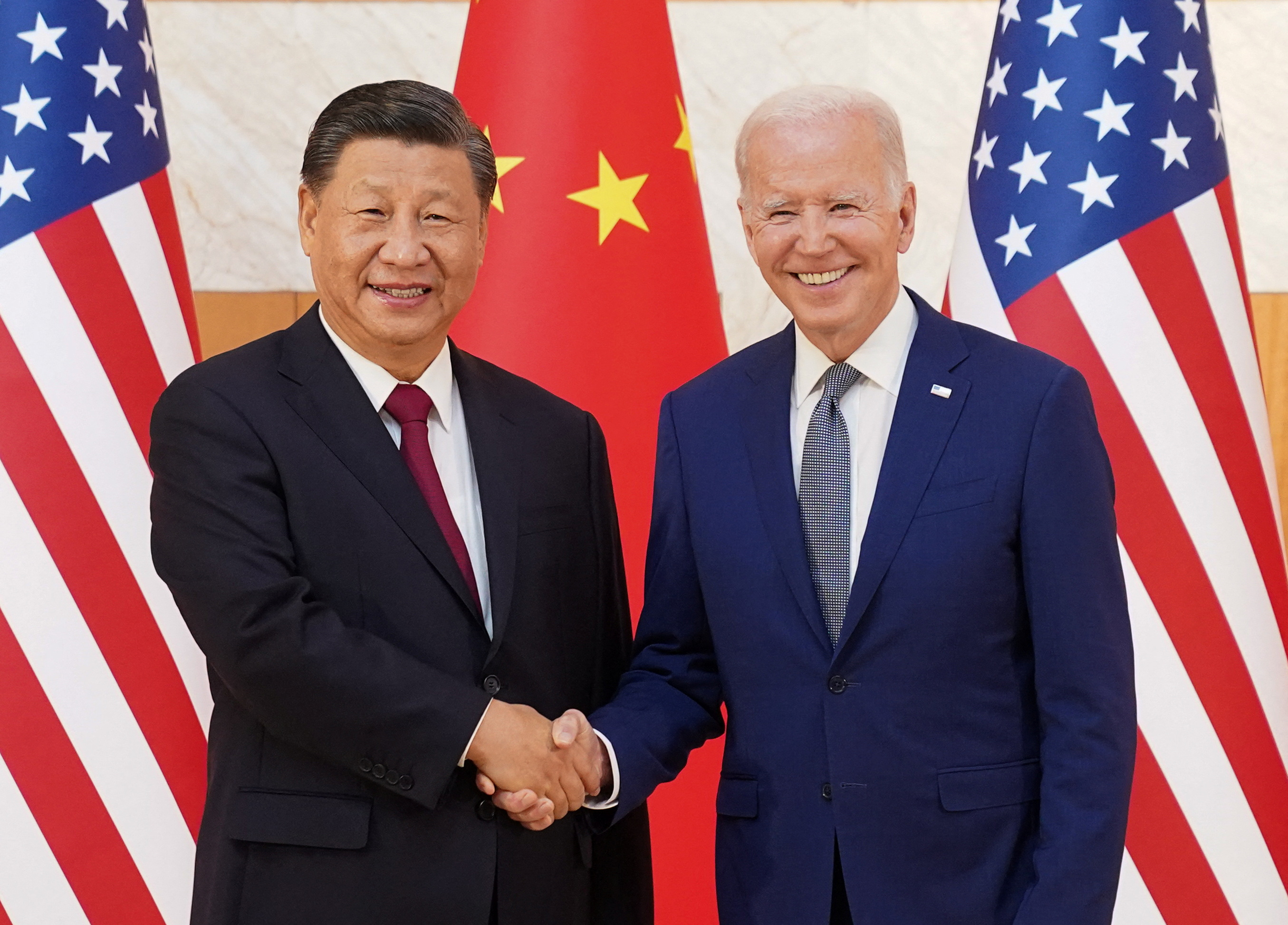 US President Joe Biden shakes hands with Chinese President Xi Jinping as they meet on the sidelines of the G20 leaders' summit in Bali, Indonesia.