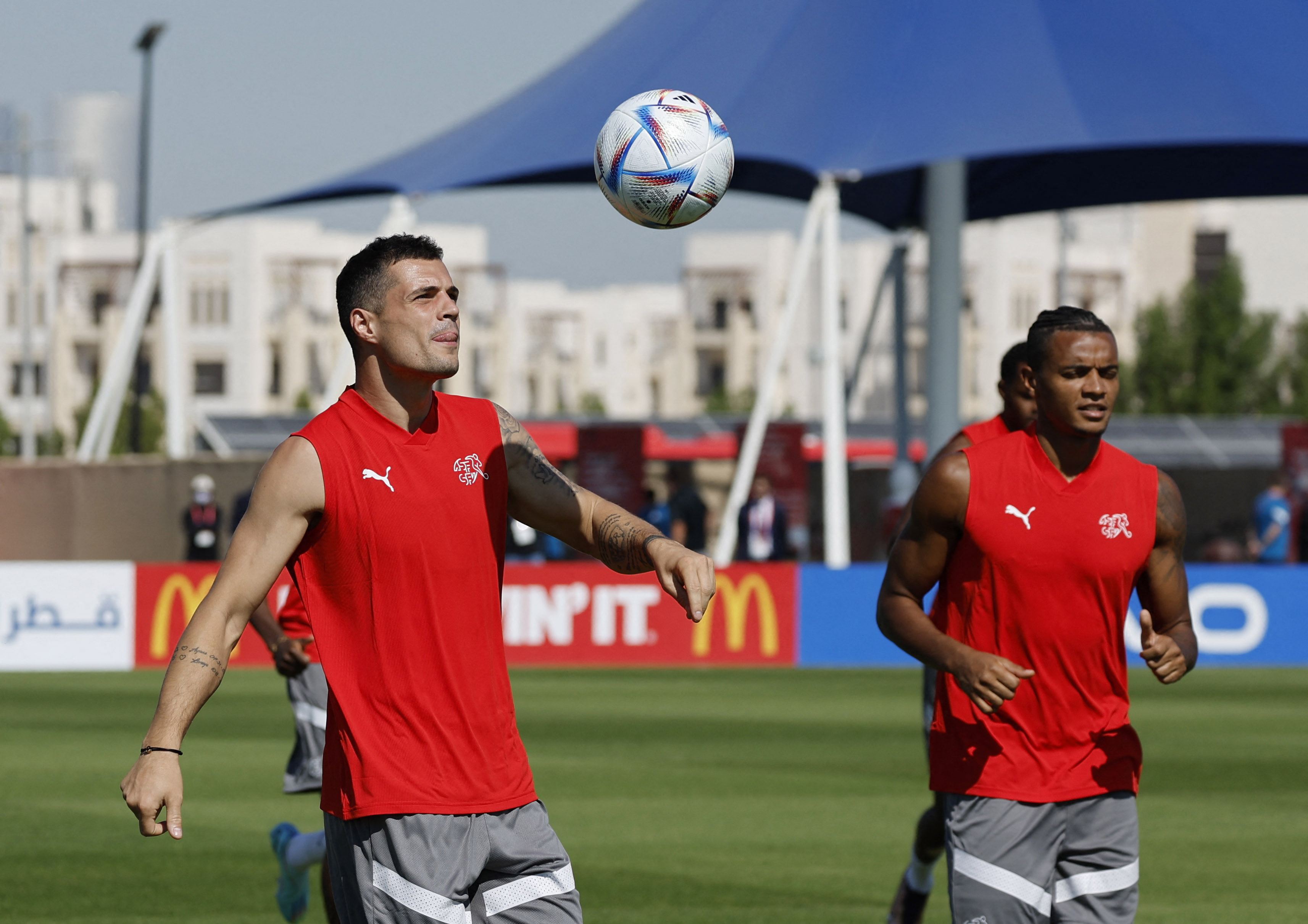 Soccer Football - FIFA World Cup Qatar 2022 - Switzerland Training - University of Doha Training Facilities, Doha, Qatar - November 23, 2022 Switzerland's Granit Xhaka and Manuel Akanji during training REUTERS/Suhaib Salem