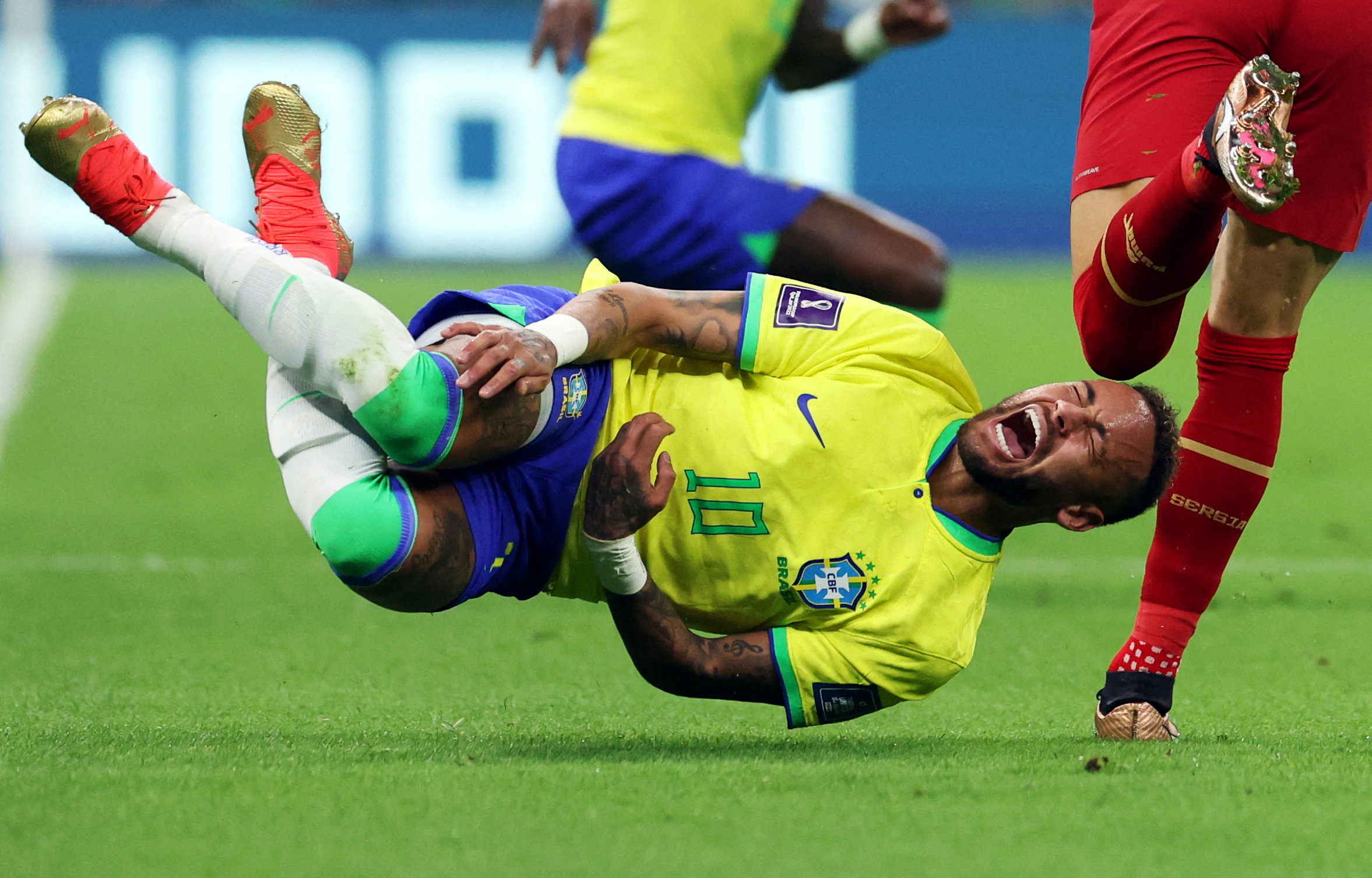 Brazil's Neymar reacts after a challenge from Serbia'a Sasa Lukic