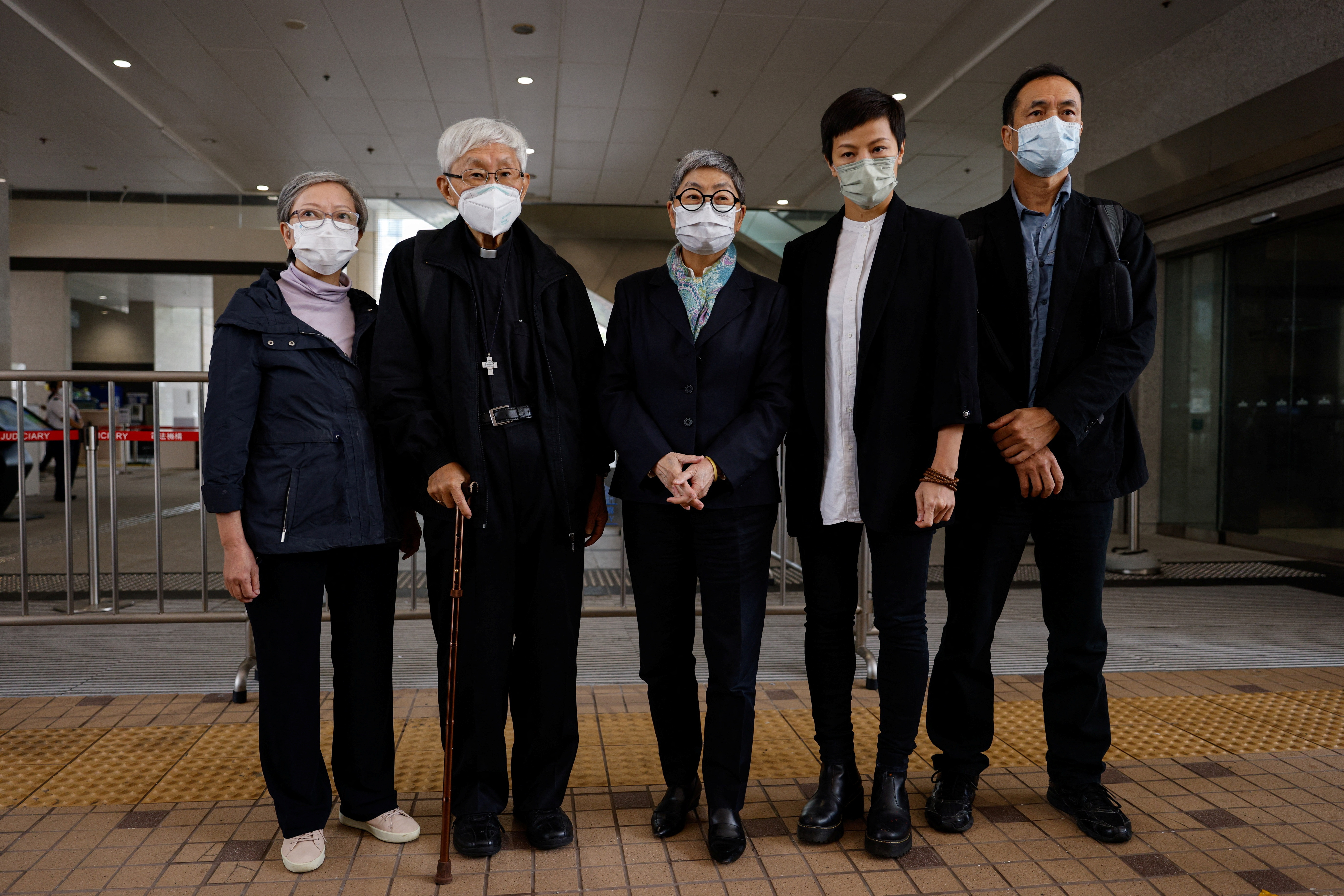 Retired bishop Cardinal Joseph Zen Ze-kiun, senior barrister Margaret Ng, former academic Hui Po Keung, former member of the Legislative Council of Hong Kong Cyd Ho Sau-lan and singer Denise Ho leave the West Kowloon Magistrates' courts