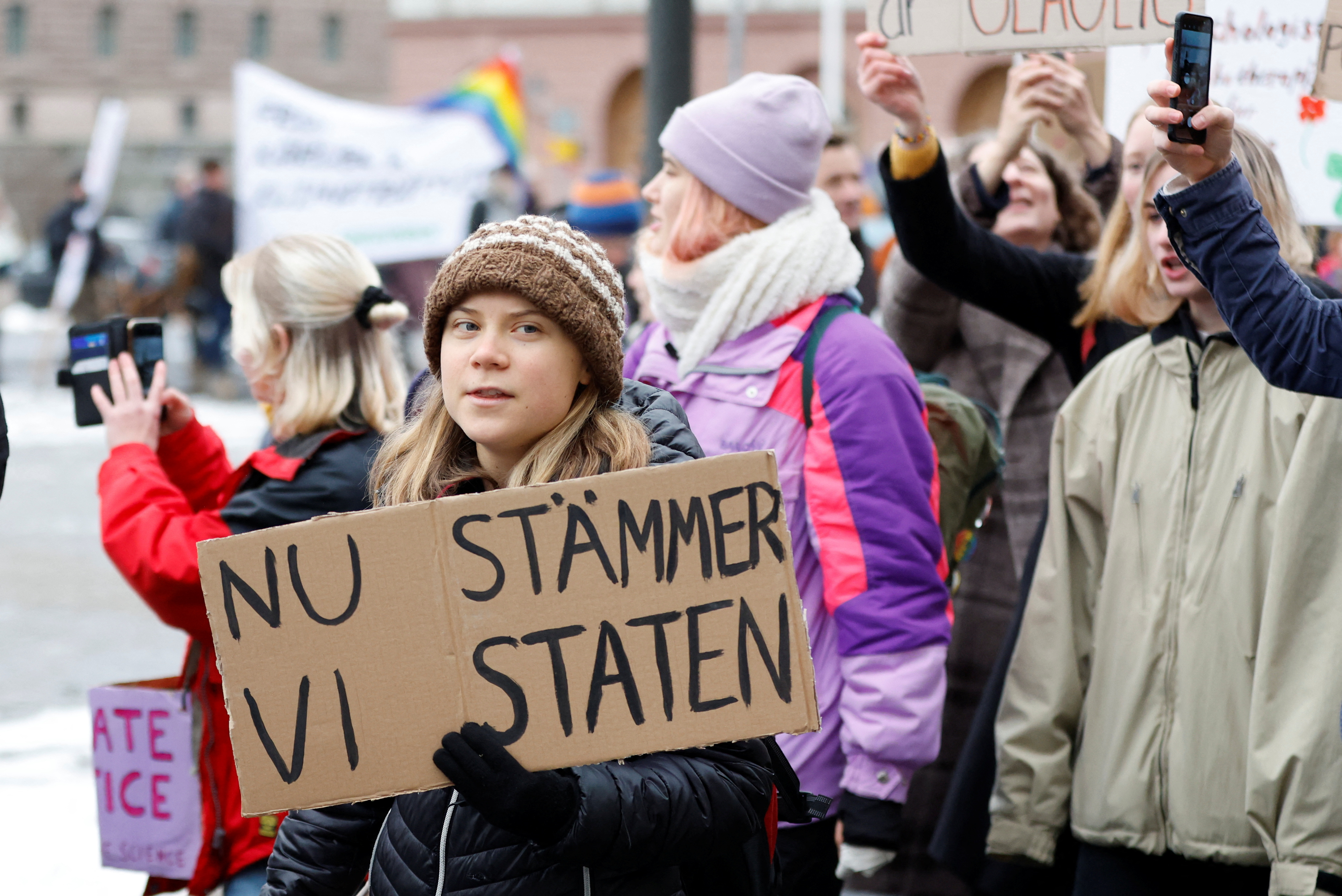 Swedish climate activist Greta Thunberg holds a placard during a demonstration held by the youth-led climate organization Aurora before submitting its lawsuit against the state for their lack of climate work, in Stockholm