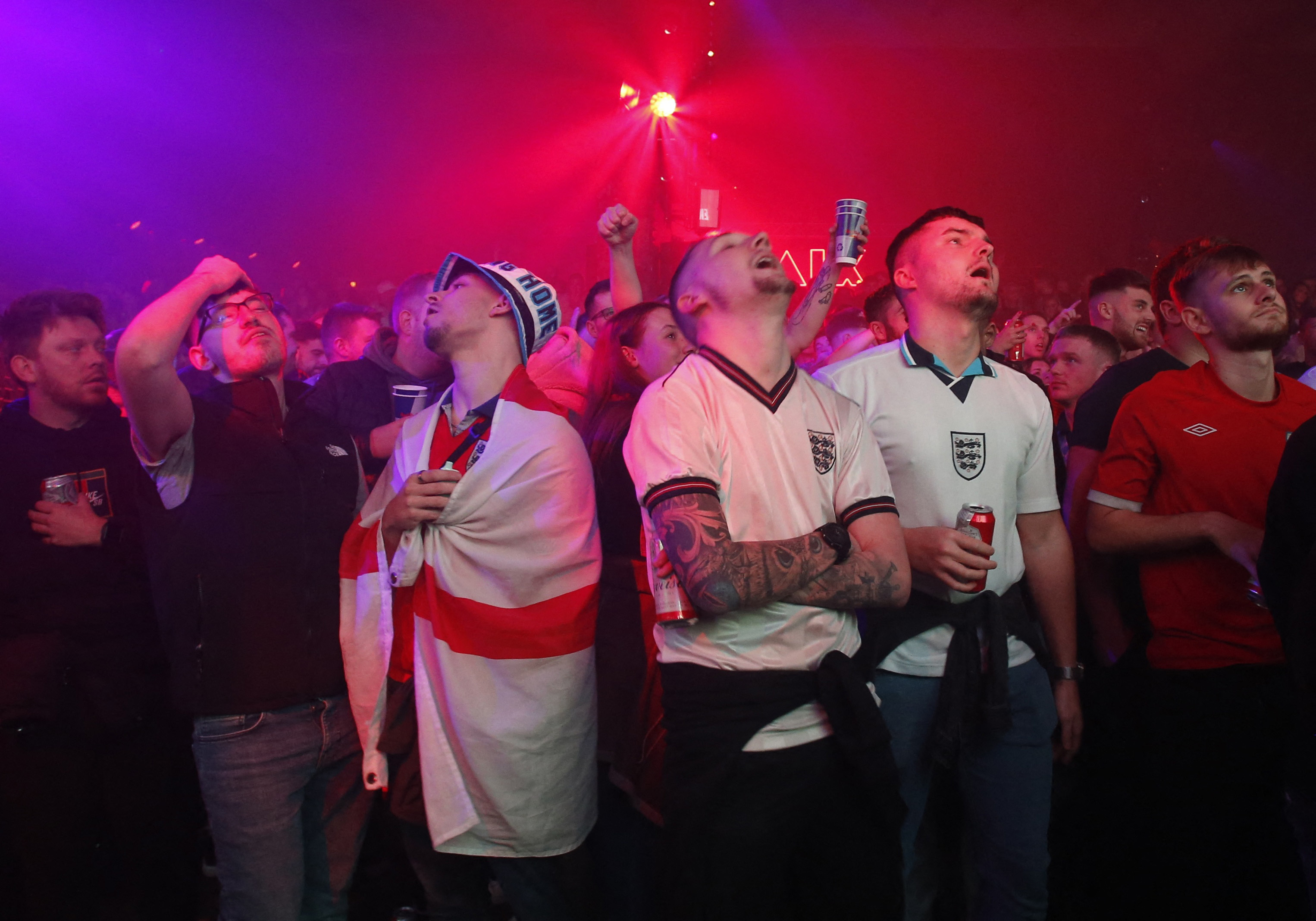 Fans in Manchester watch the England vs United States football match.