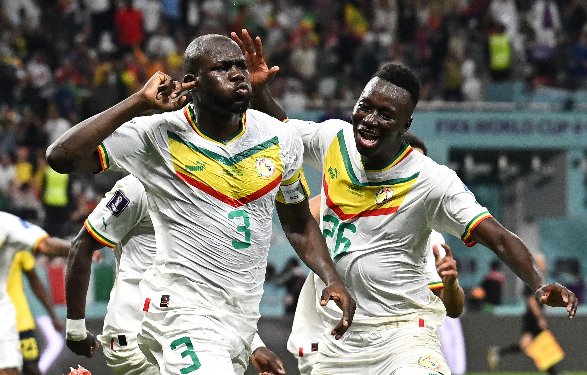 Senegal's Kalidou Koulibaly celebrates scoring their second goal with teammates
