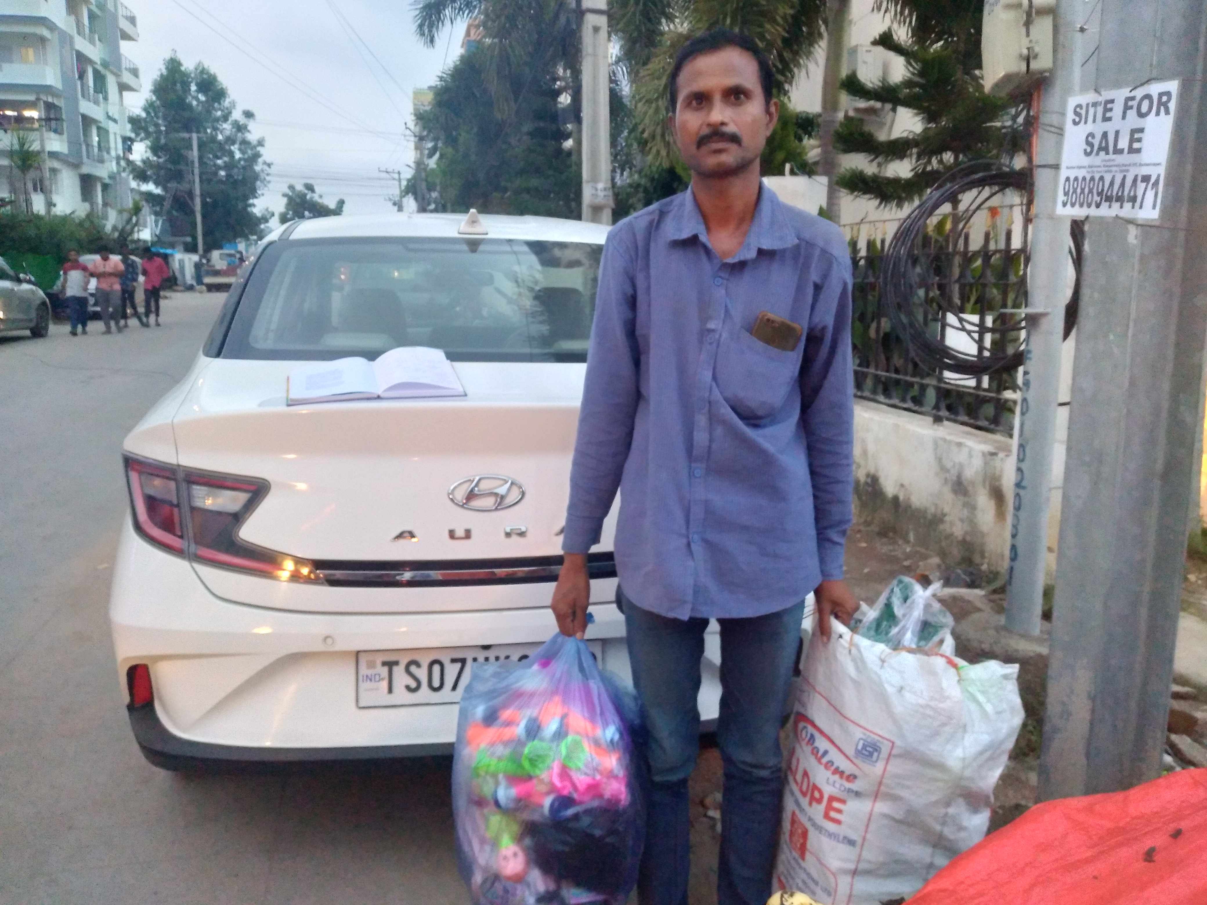 A man carries bags of good to sell