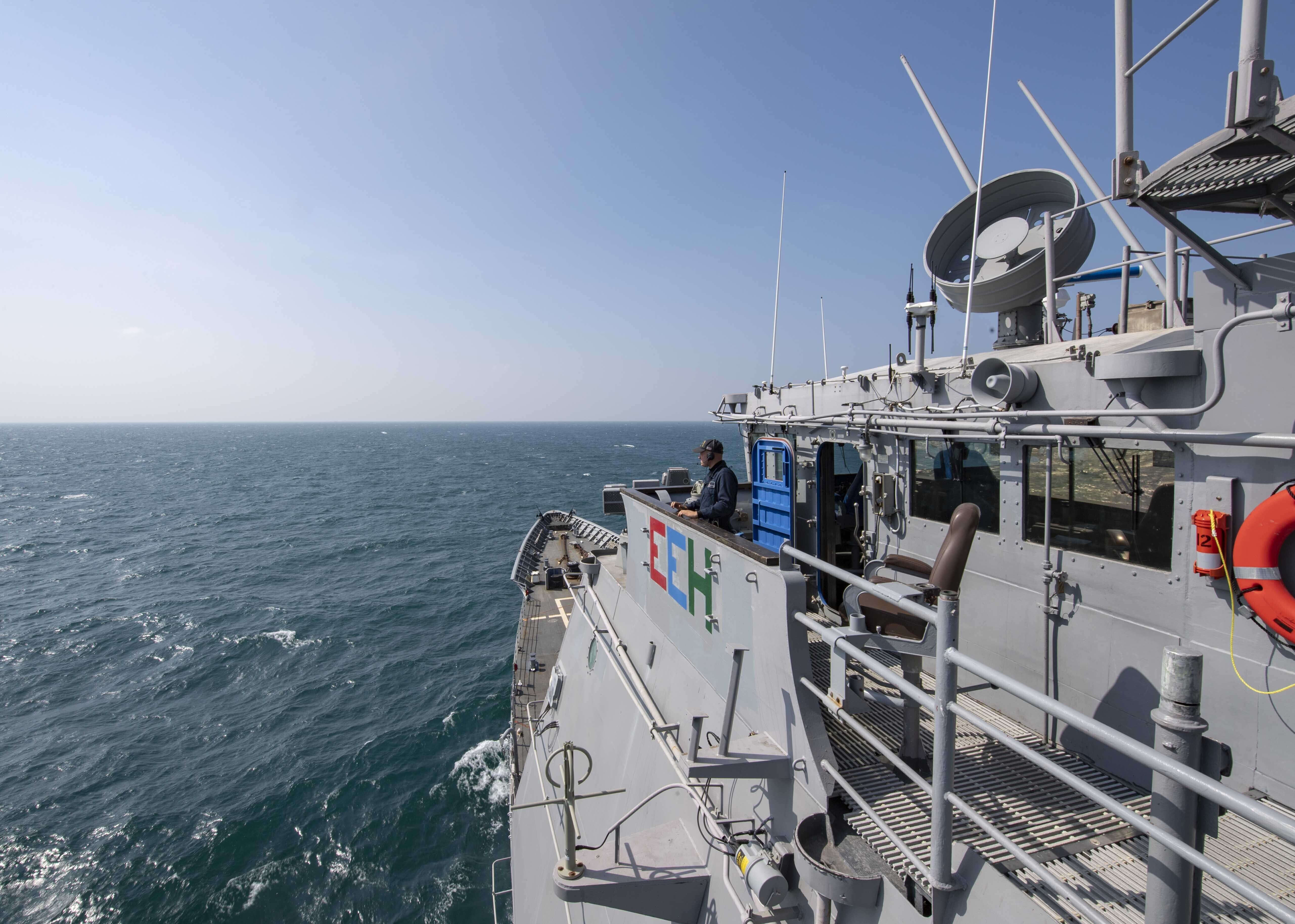 A view to the sea showing the bow of the USS Chancellorsville