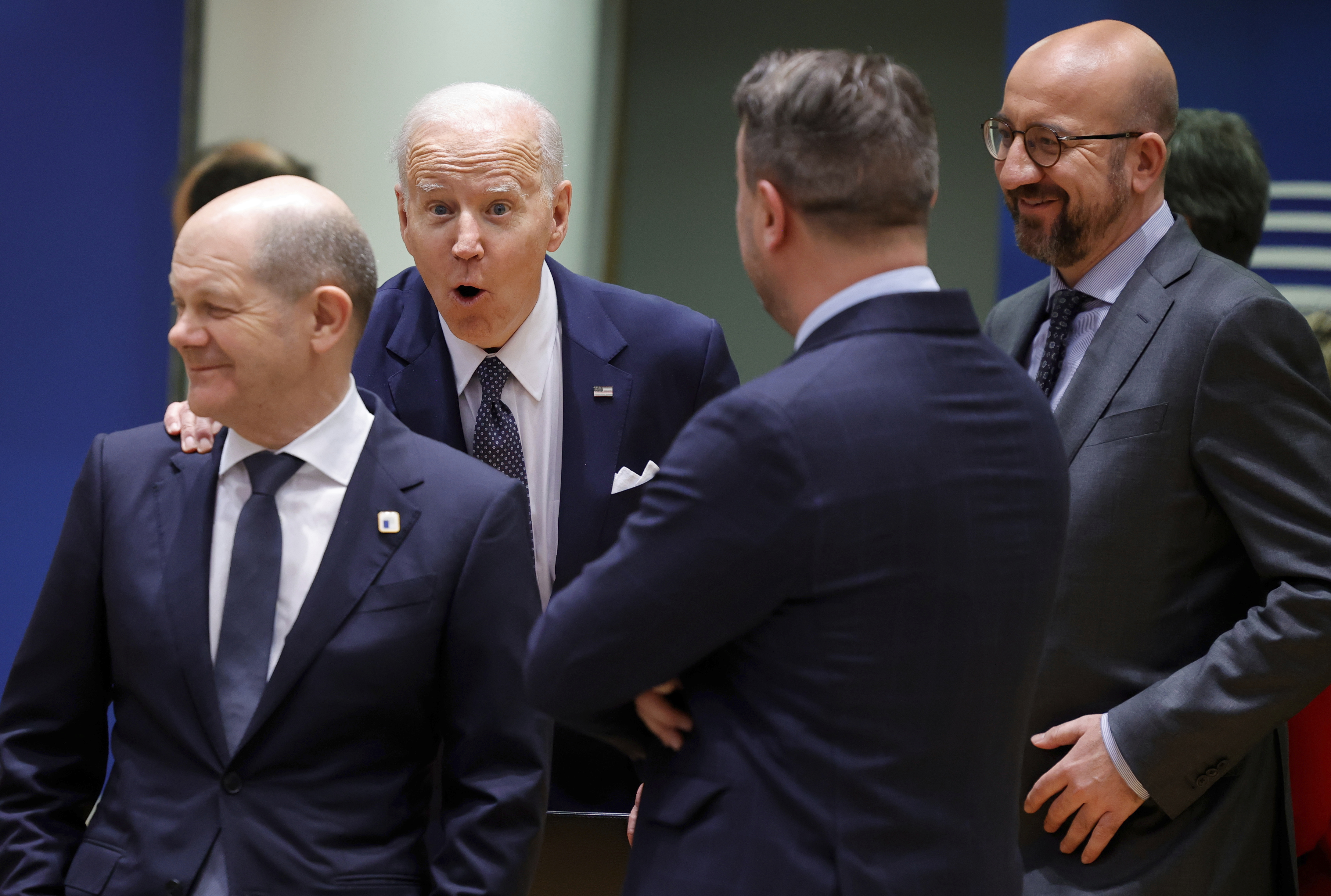 U.S. President Joe Biden, center, speaks with from left, German Chancellor Olaf Scholz, Luxembourg's Prime Minister Xavier Bettel and European Council President Charles Michel during a round table meeting at an EU summit in Brussels, Thursday, March 24, 2022. As the war in Ukraine grinds into a second month, President Joe Biden and Western allies are gathering to chart a path to ramp up pressure on Russian President Vladimir Putin while tending to the economic and security fallout that's spreading across Europe and the world. (AP Photo/Olivier Matthys)