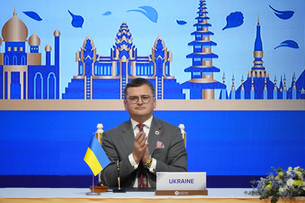 Ukraine Foreign Minister Dmytro Kuleba applauds during the signing ceremony of a Treaty of Amity and Cooperation with Southeast Asian nations in Phnom Penh, Cambodia, Thursday, Nov. 10, 2022. (AP Photo/Vincent Thian)