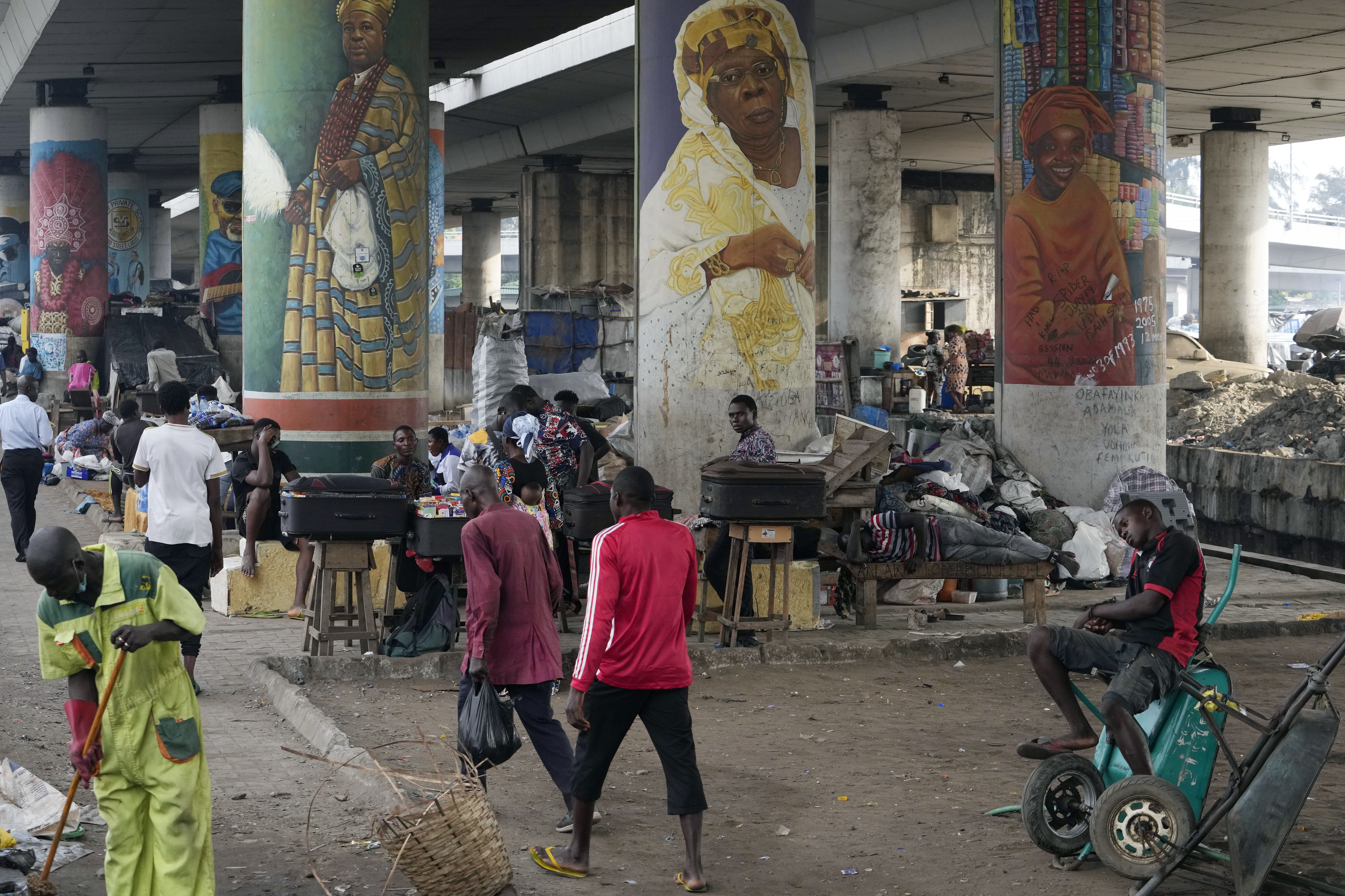 People walk during rush hours in Lagos, Nigeria
