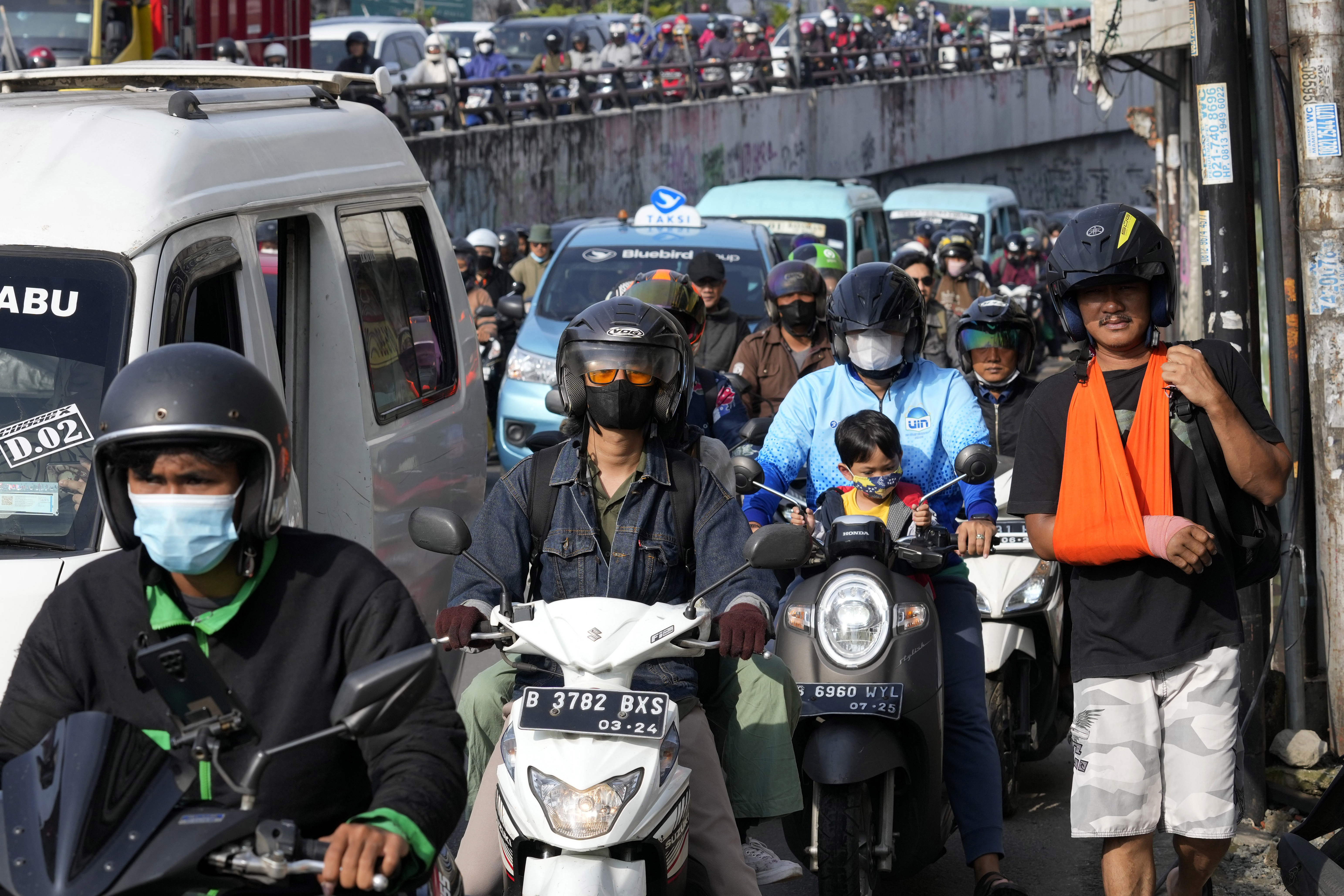 Motorists are stuck in the morning rush hour traffic in Jakarta,