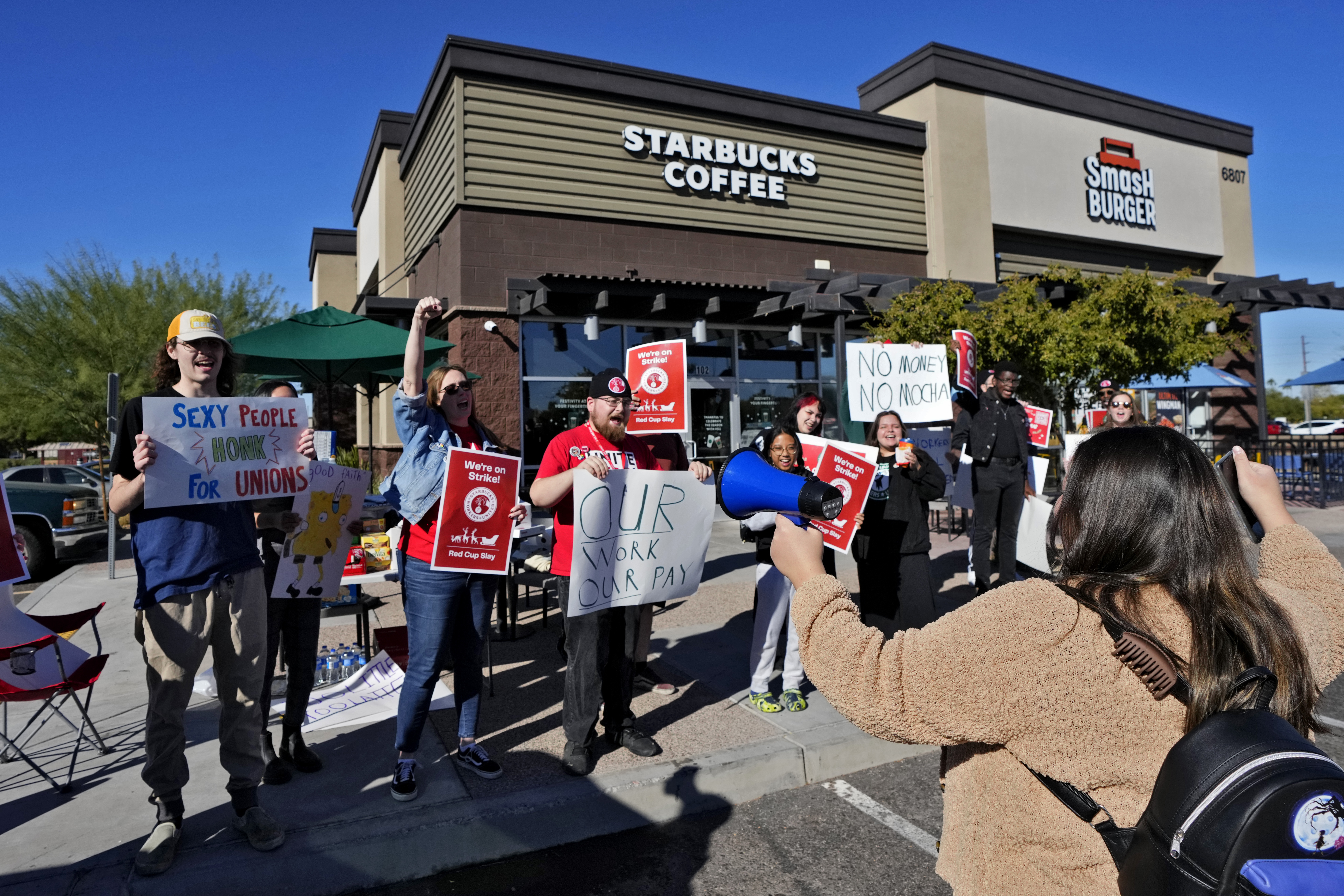 Starbucks employees strike outside their store, in Mesa, Arizona in US.